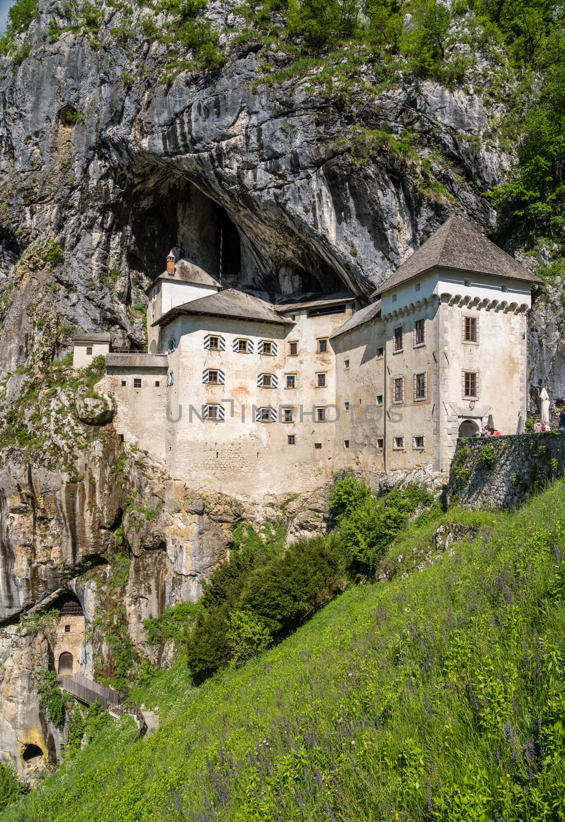 Famous castle of Predjama built into a cave in mountain in Slovenia