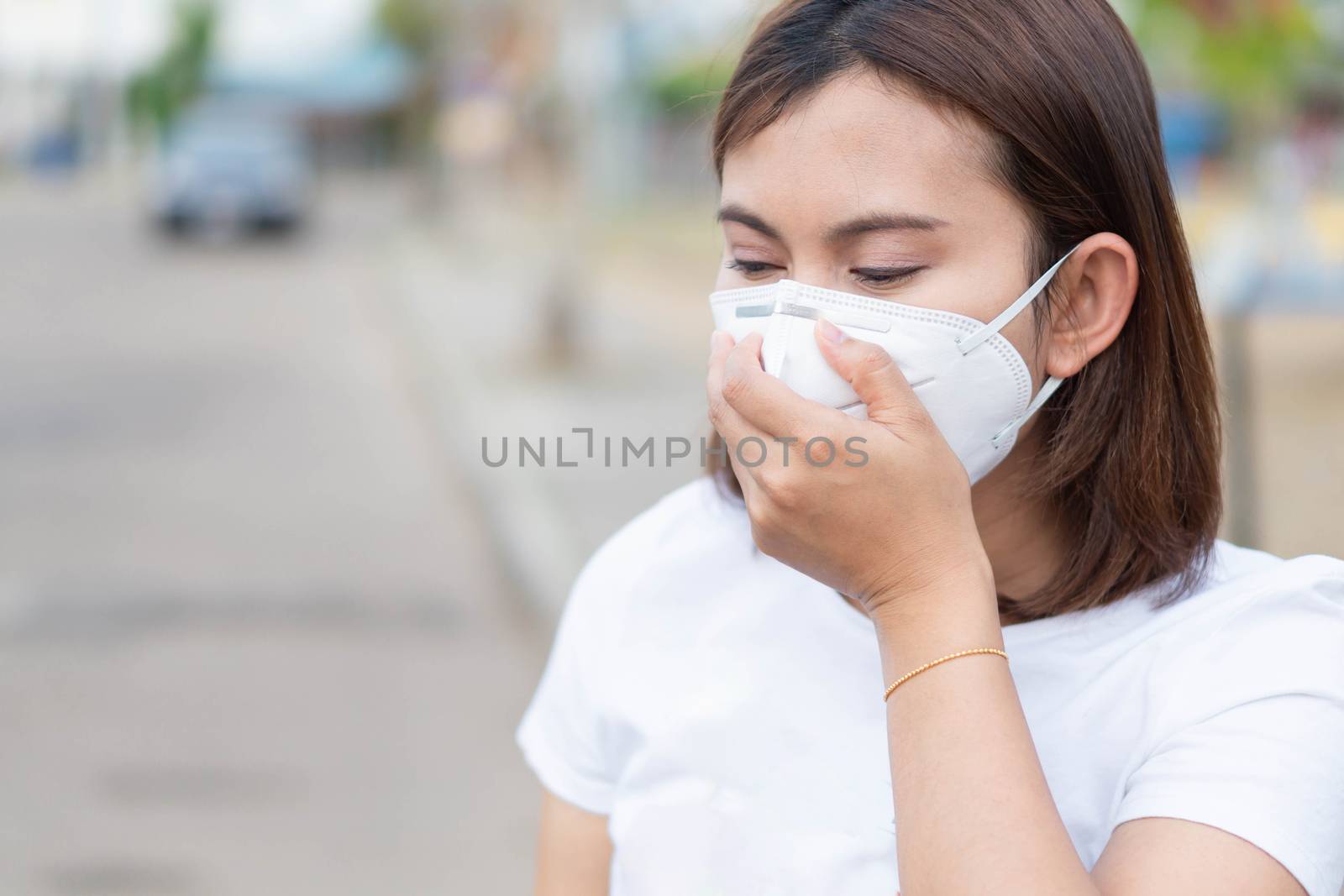 Closeup woman wearing face mask for protect air polution, health by pt.pongsak@gmail.com