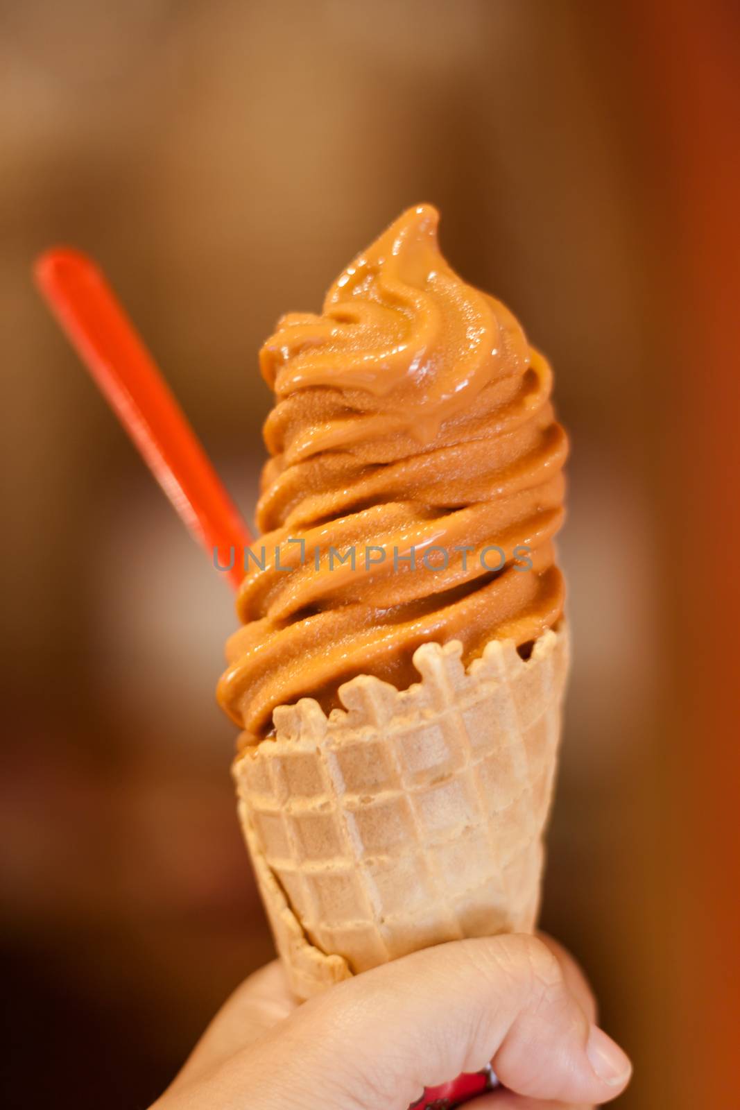 Ice cream cone on hand, stock photo