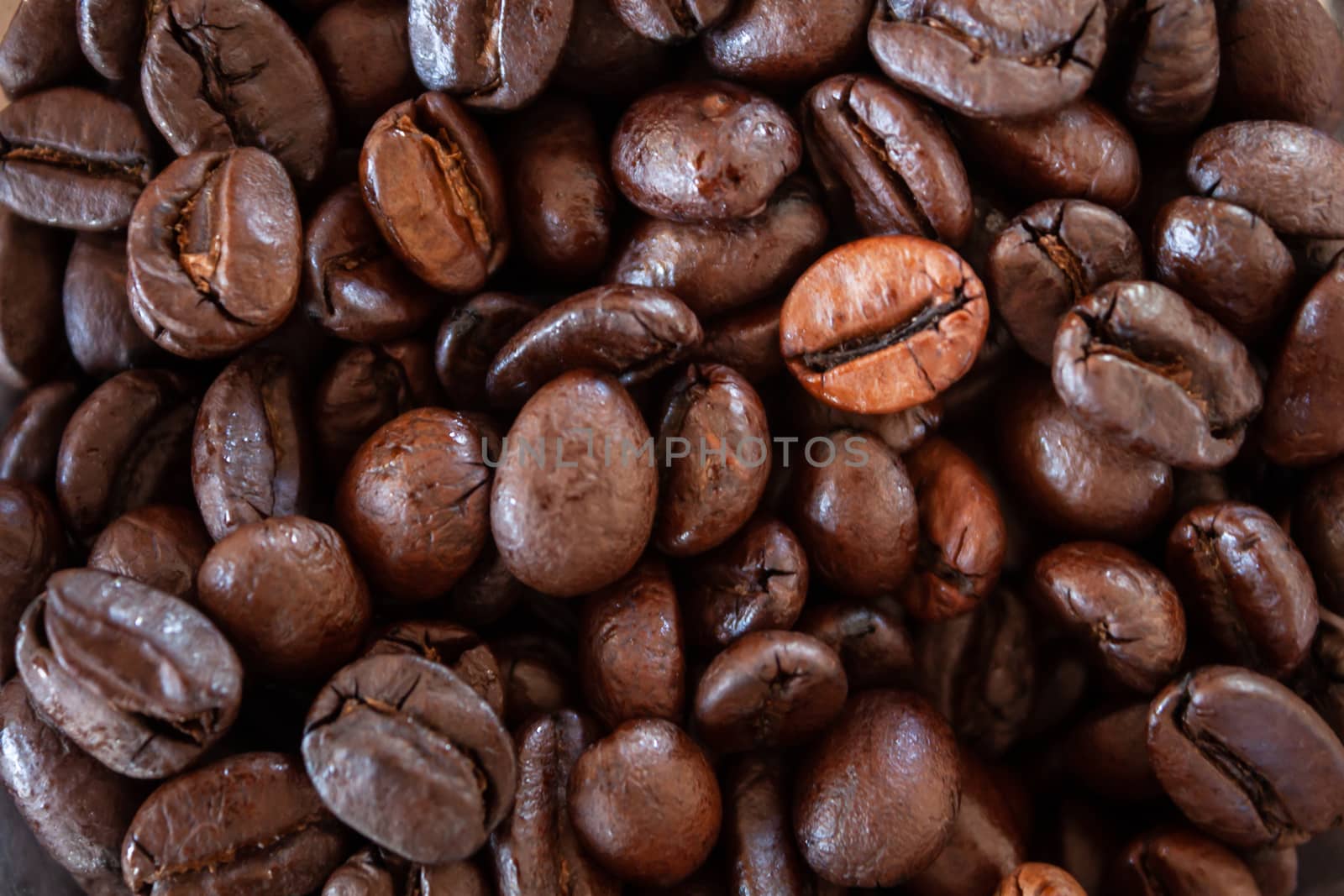 Close up coffee beans background by punsayaporn