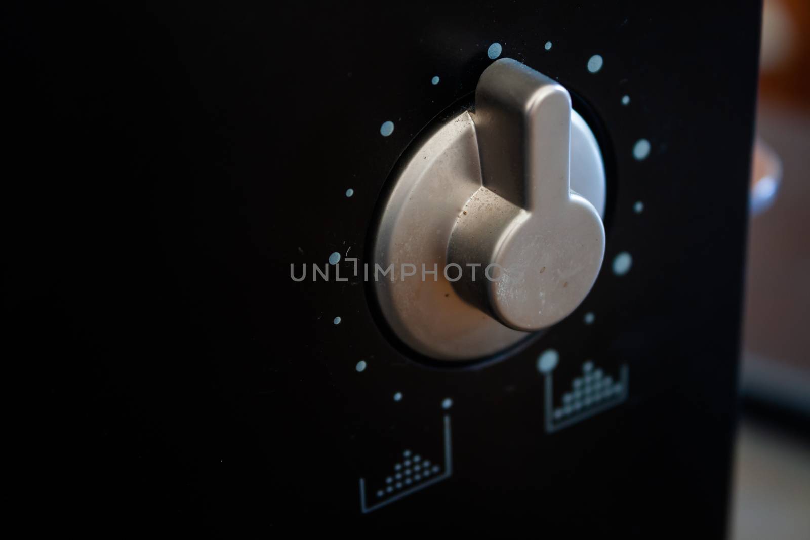 Dial knob on black background by punsayaporn