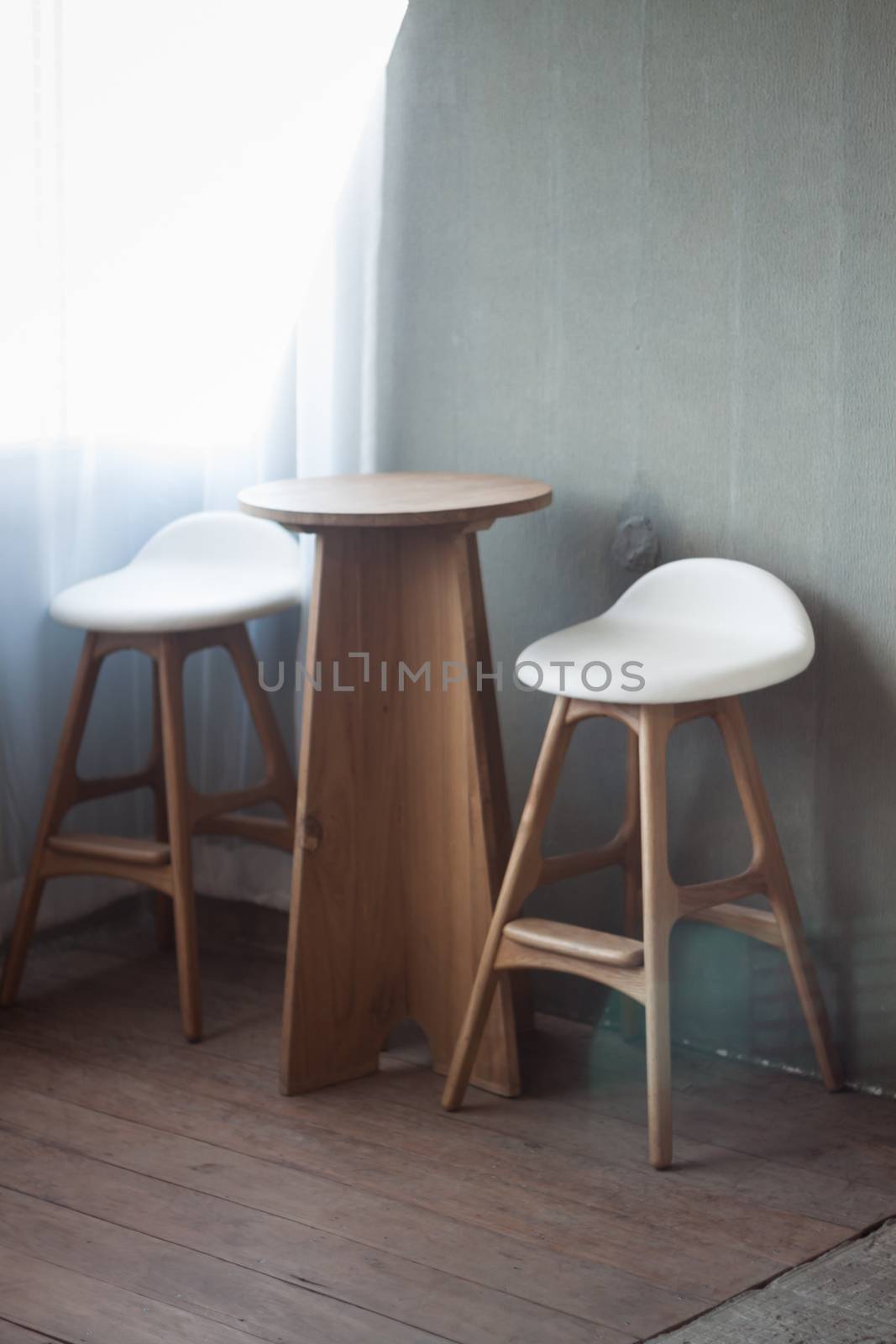 Elegant chairs with empty concrete background, stock photo