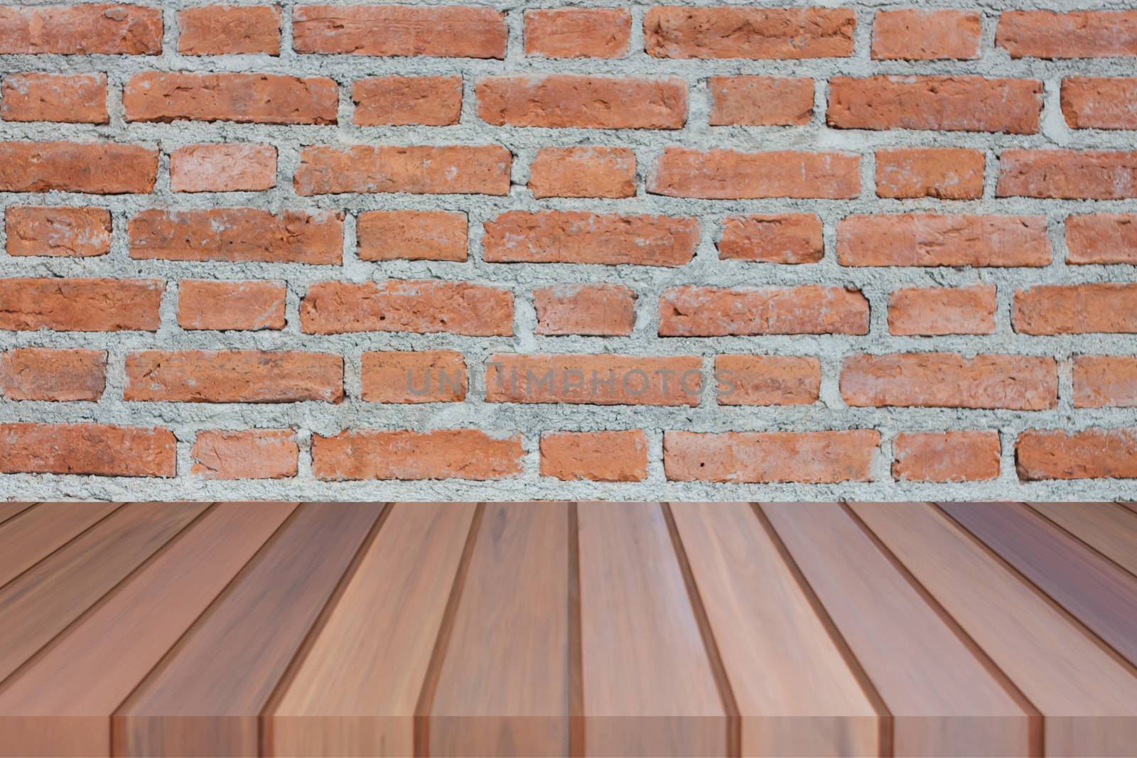 Brown wooden table top on brick wall. For product display