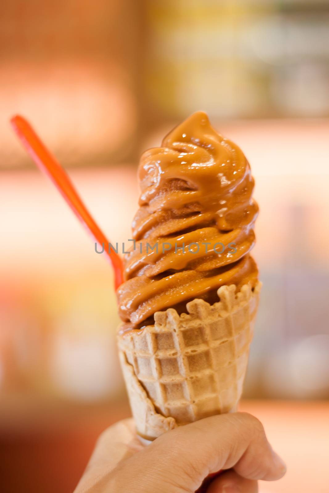 Ice cream cone on hand by punsayaporn