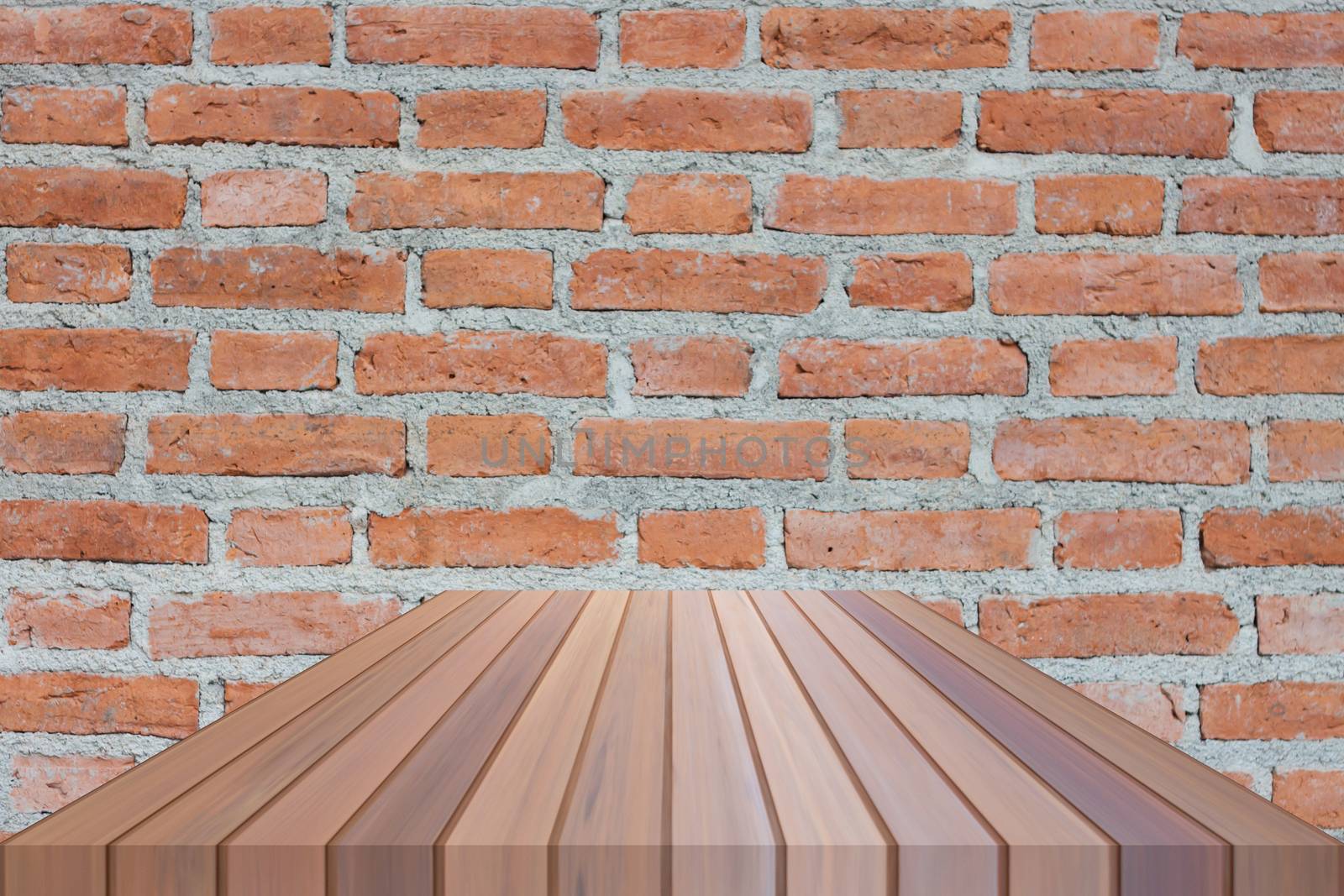 Brown table top on brick wall by punsayaporn