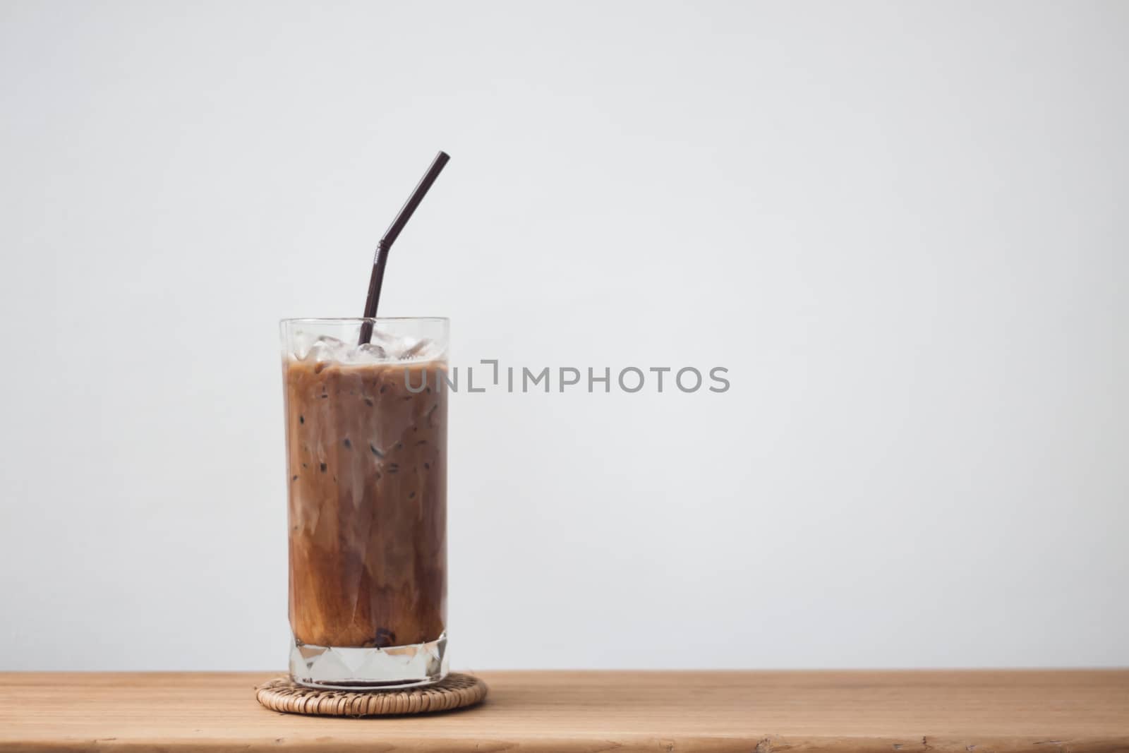Ice coffee on wooden table, stock photo