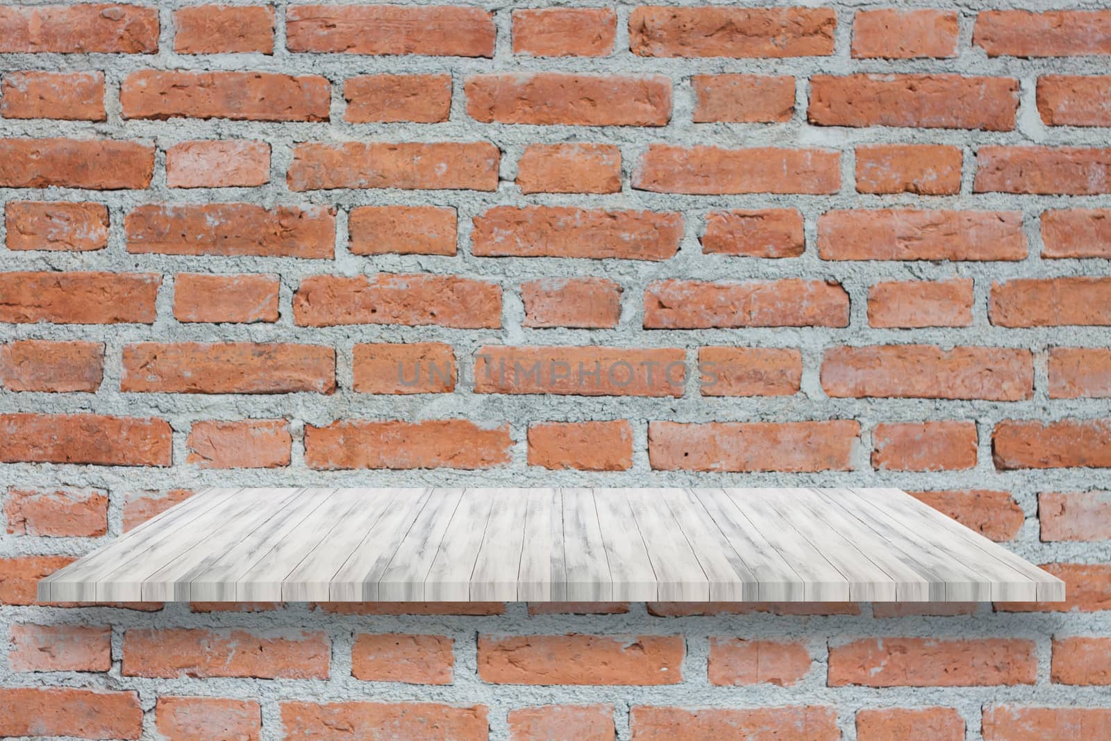 Top of white wooden shelf on brick wall by punsayaporn