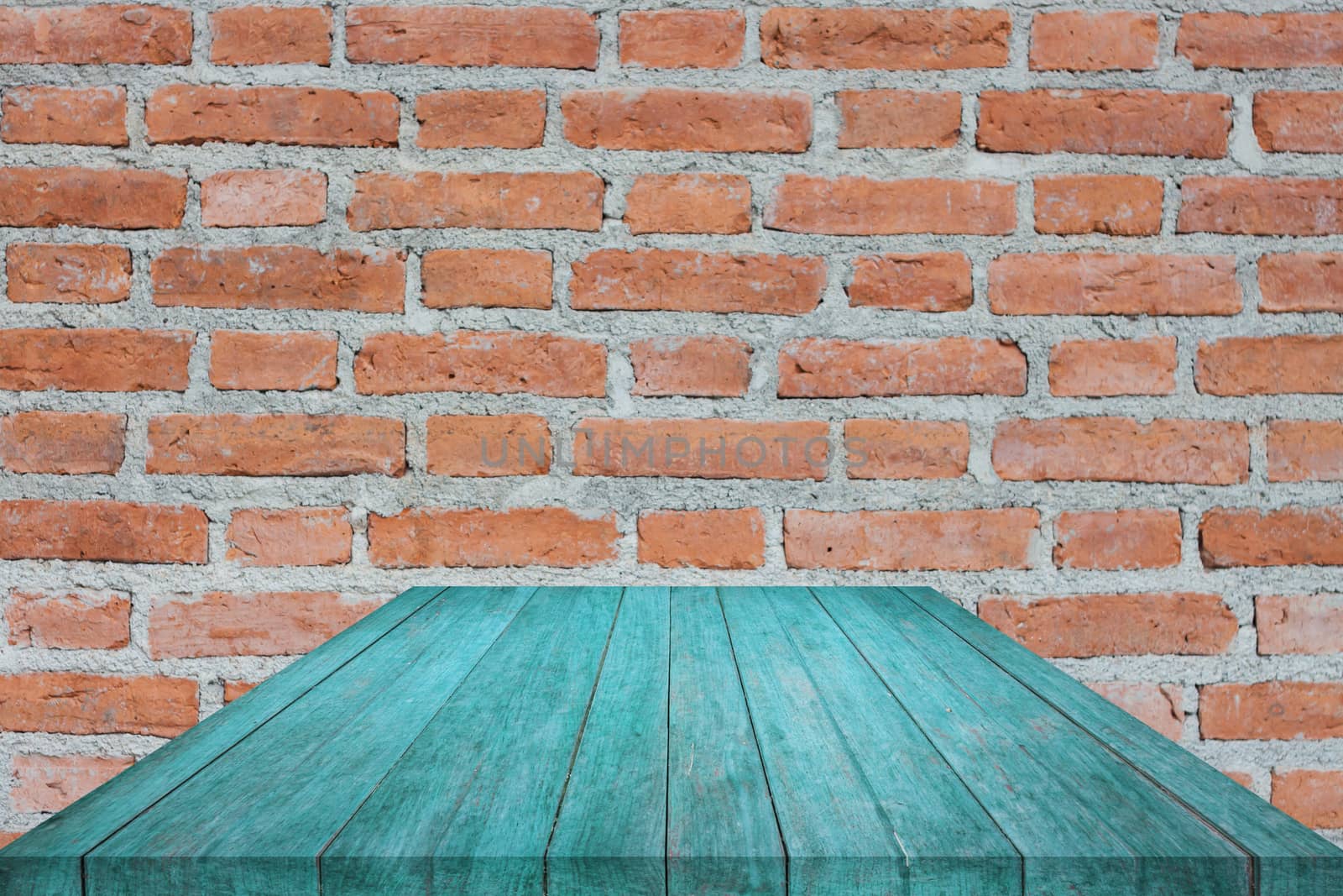 Perspective blue top wooden on brick wall by punsayaporn