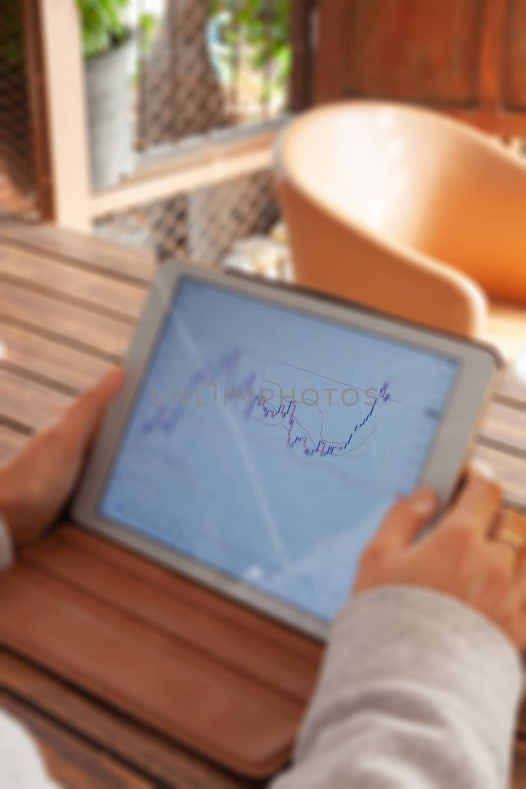 Woman hand trading online on tablet, stock photo