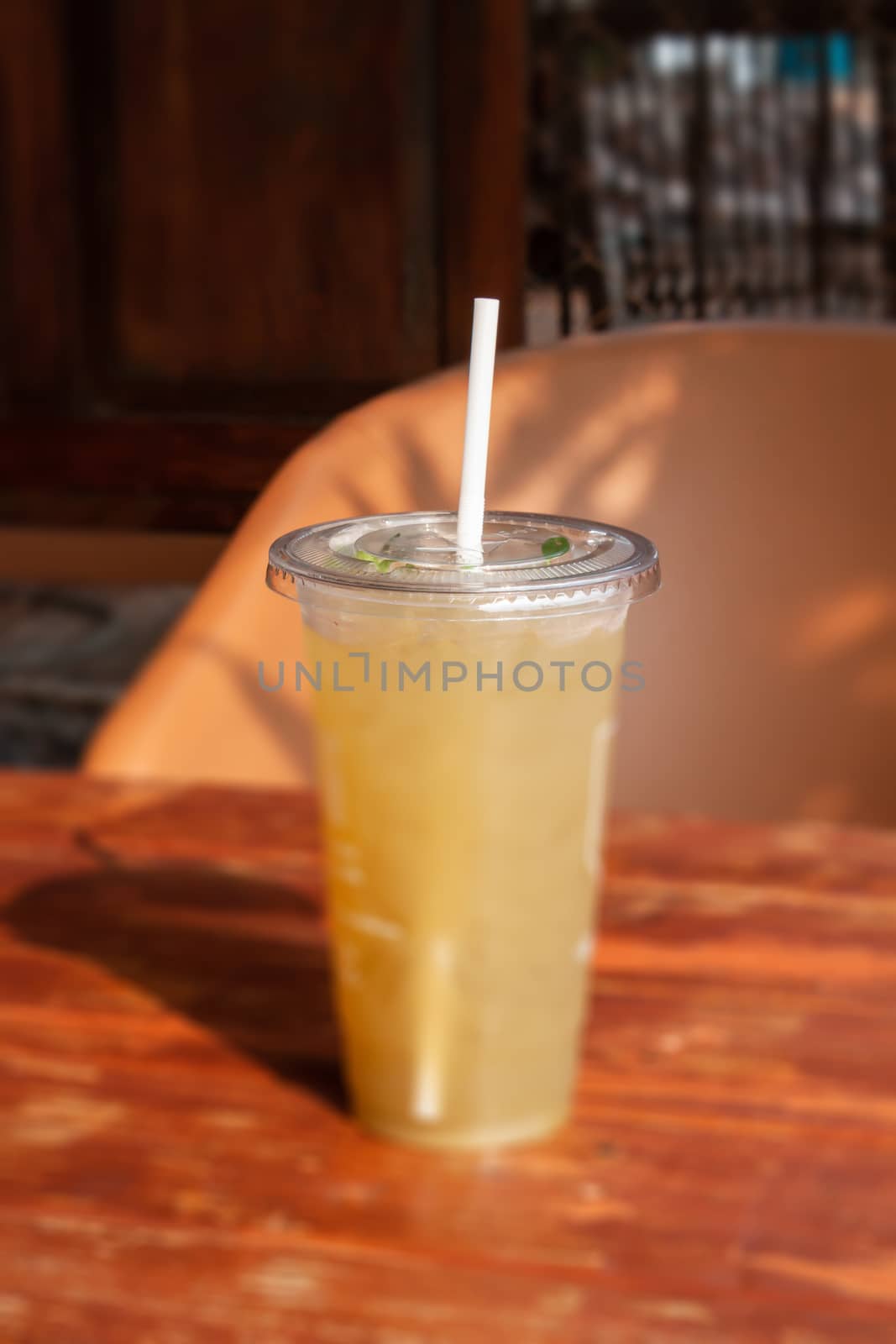 Iced coffee in coffee shop on wooden table by punsayaporn