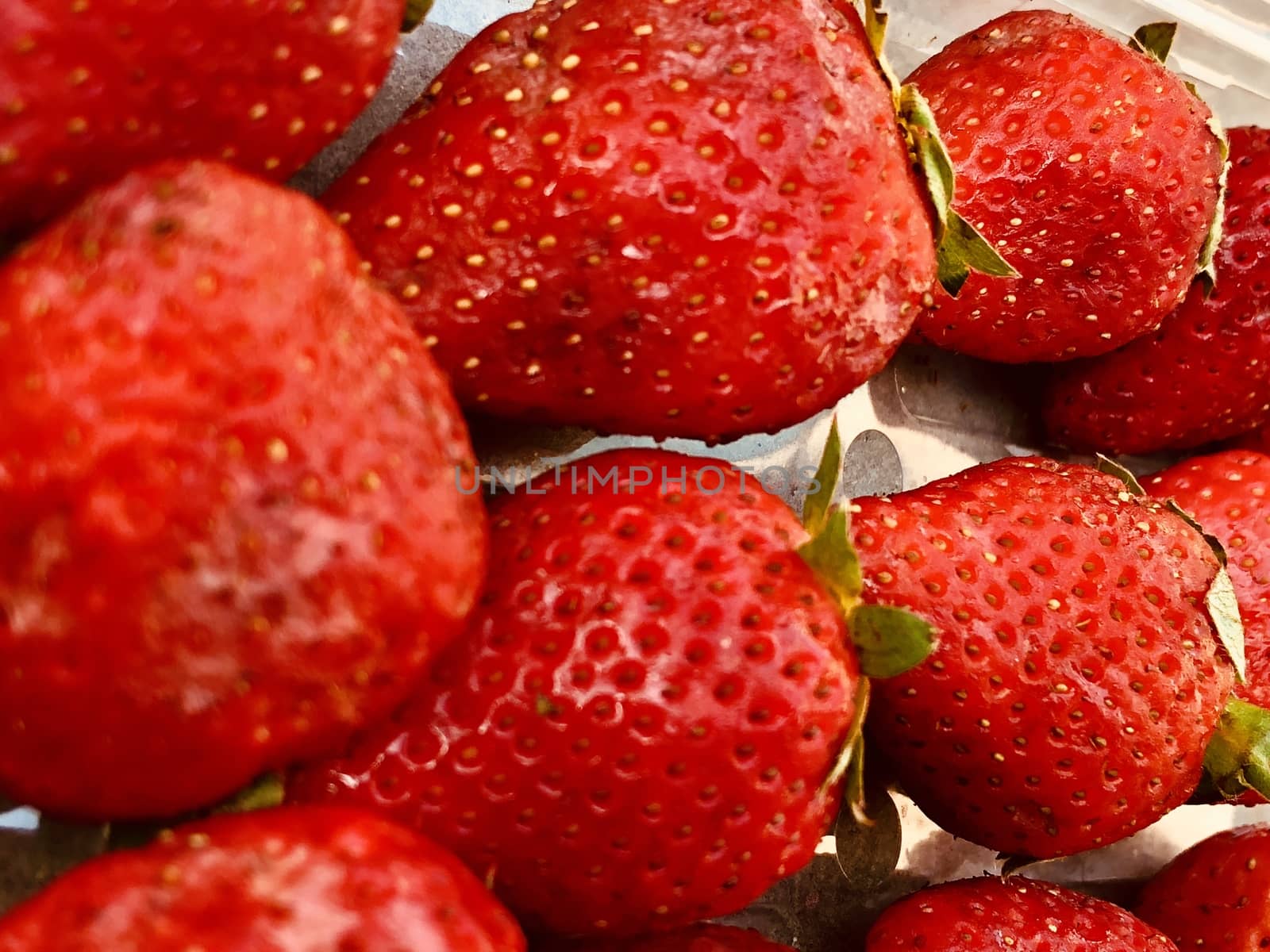 Beautiful view of red color strawberry fruit kept for sale in the market