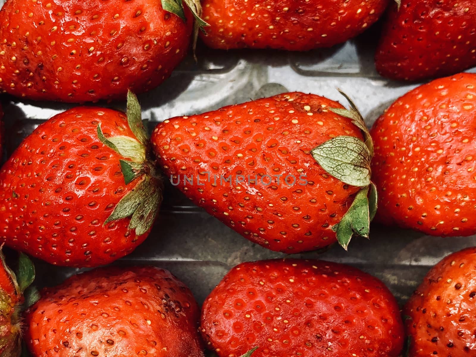 Beautiful view of red color strawberry fruit kept for sale in the market