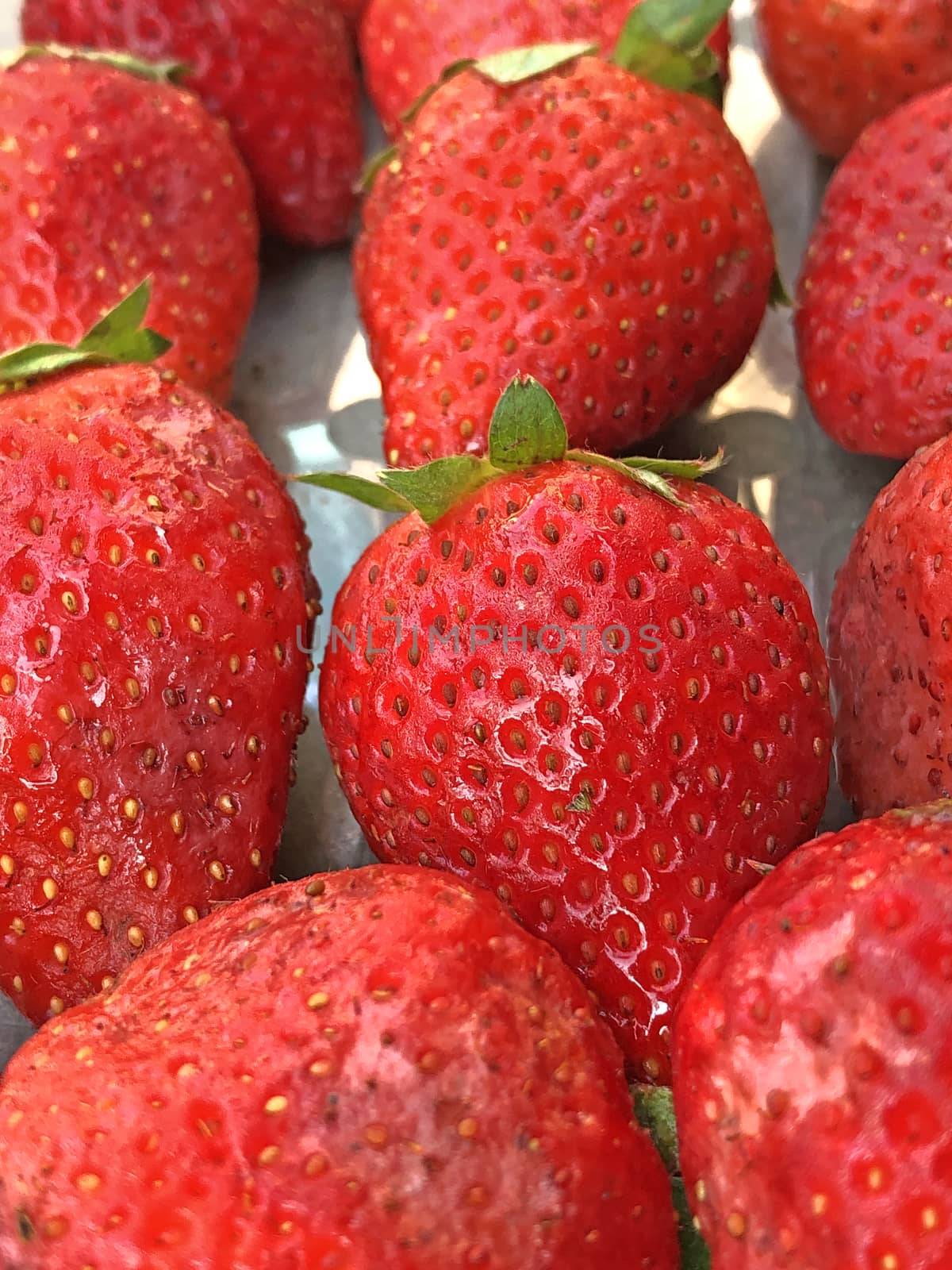 Beautiful view of red color strawberry fruit kept for sale in the market