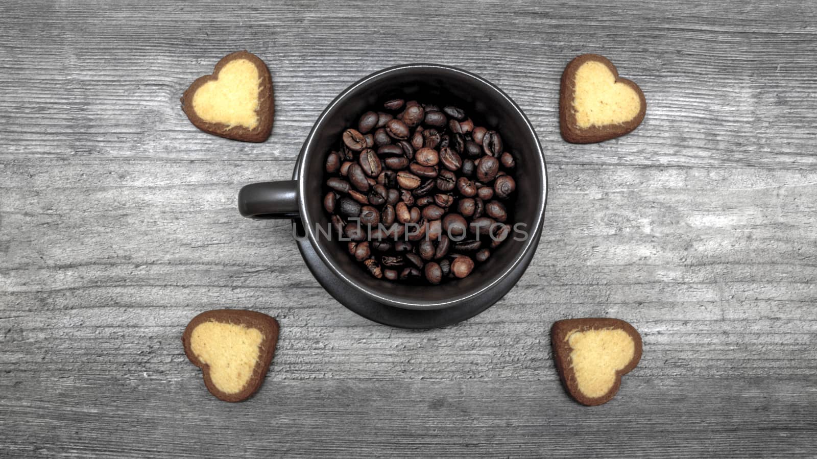 coffee with cookies. Ripe coffee beans in a coffee mug with cookies in the form of hearts