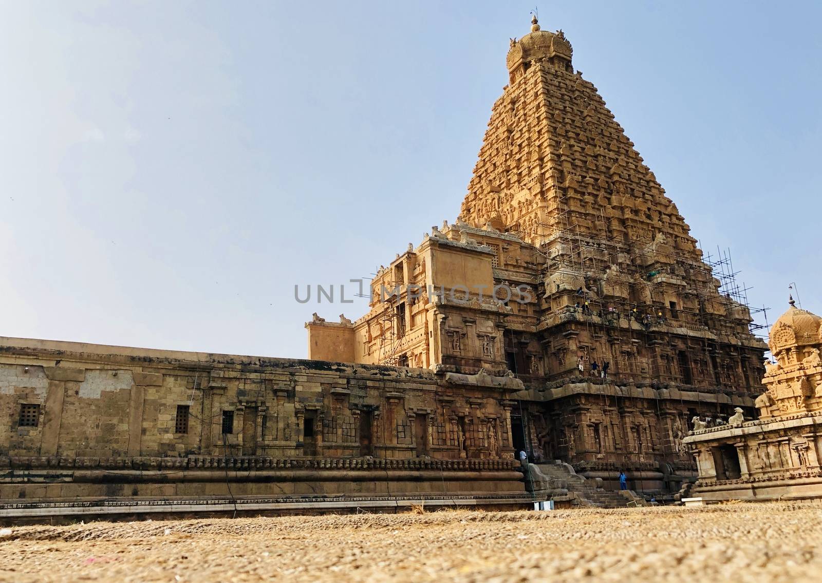 The Brihadisvara temple or Brihadeeswar temple located in Thanjavur, Tamilnadu built by Tamil King Raja Raja Chola-I between 1003 and 1010 AD. This is the Hindu temple built in Dravidian architecture style. The temple is entirely built with granite stones and the temple contains many monolithic sculptures in it. This temple is one of the `Great Living Chola Temples` and also tamil words are inscribed in the wall of the temple. This temple is dedicated to Lord shiva and it is a UNESCO World Heritage Site.
