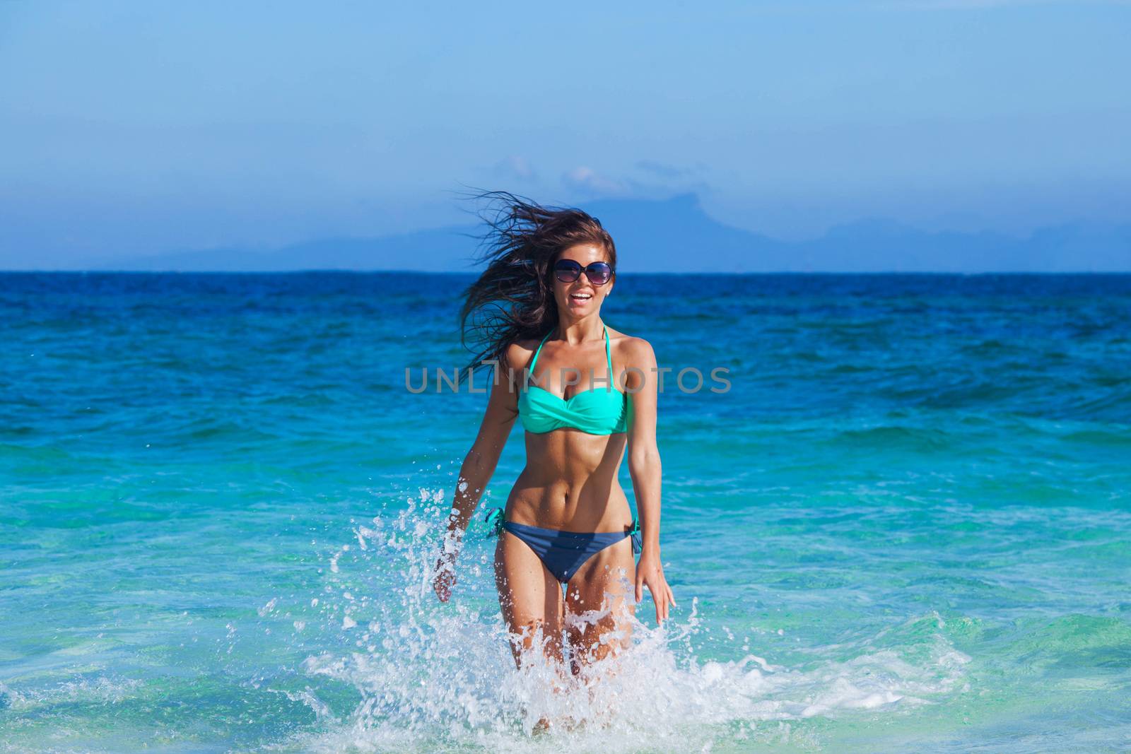 Girl running in sea waves by Yellowj