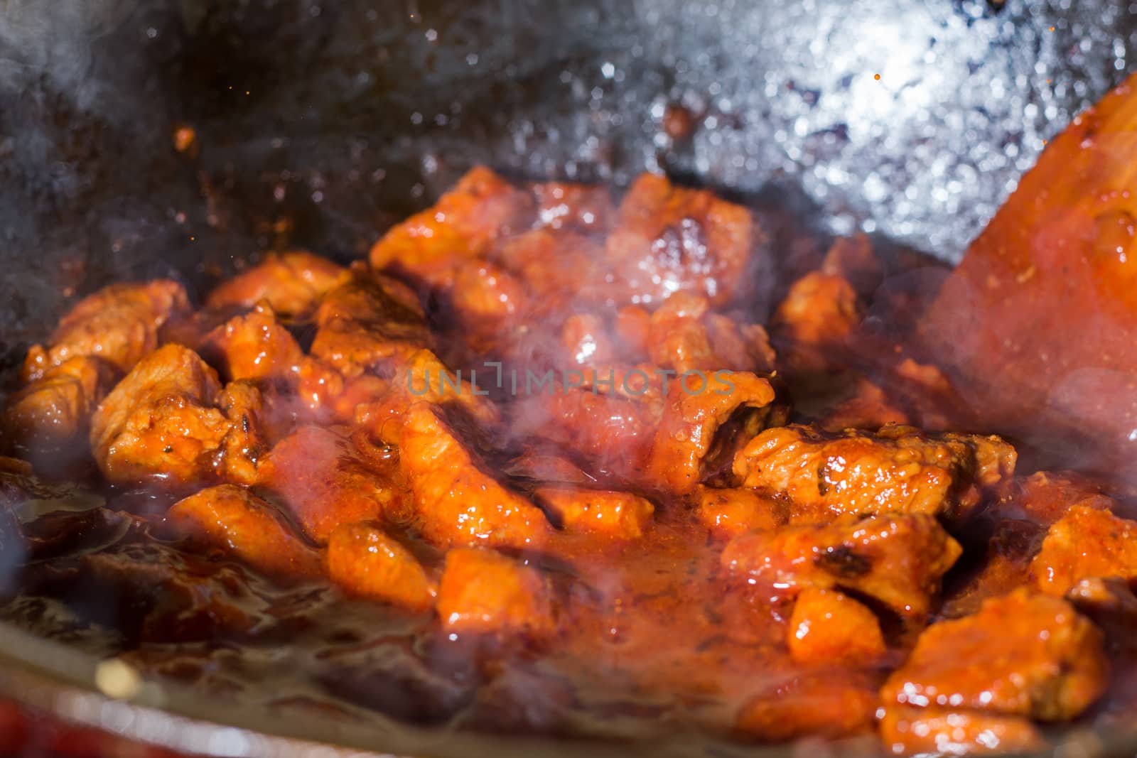 Fried pieces of meat in a pan. Cooking meat with gravy. Roasted  by YevgeniySam