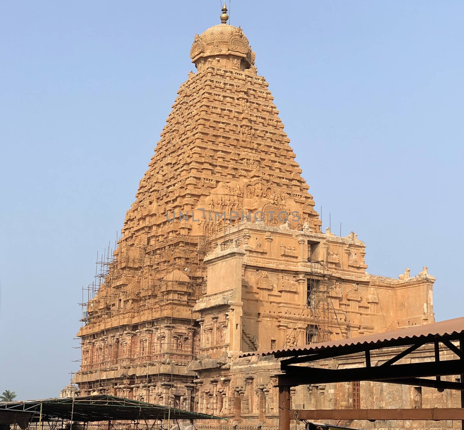 The Brihadisvara temple or Brihadeeswar temple located in Thanjavur, Tamilnadu built by Tamil King Raja Raja Chola-I between 1003 and 1010 AD. This is the Hindu temple built in Dravidian architecture style. The temple is entirely built with granite stones and the temple contains many monolithic sculptures in it. This temple is one of the `Great Living Chola Temples` and also tamil words are inscribed in the wall of the temple. This temple is dedicated to Lord shiva and it is a UNESCO World Heritage Site.