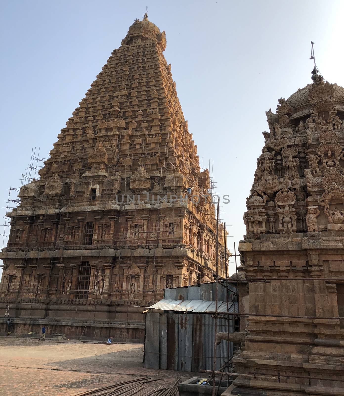 The Brihadisvara temple or Brihadeeswar temple located in Thanjavur, Tamilnadu built by Tamil King Raja Raja Chola-I between 1003 and 1010 AD. This is the Hindu temple built in Dravidian architecture style. The temple is entirely built with granite stones and the temple contains many monolithic sculptures in it. This temple is one of the `Great Living Chola Temples` and also tamil words are inscribed in the wall of the temple. This temple is dedicated to Lord shiva and it is a UNESCO World Heritage Site.