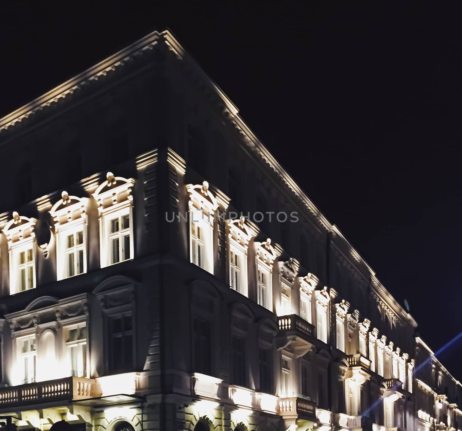 Exterior facade of classic building in the European city at night, architecture and design detail