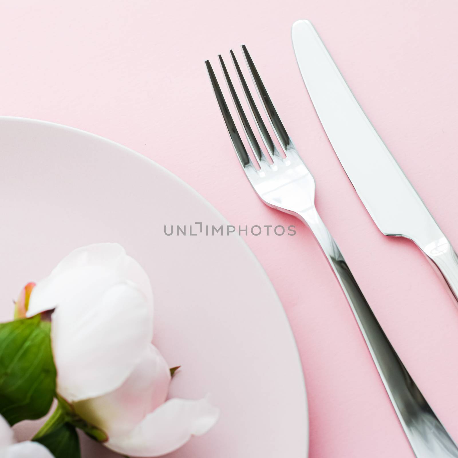 Dining plate and cutlery with peony flowers as wedding decor set on pink background, top tableware for event decoration and menu branding design