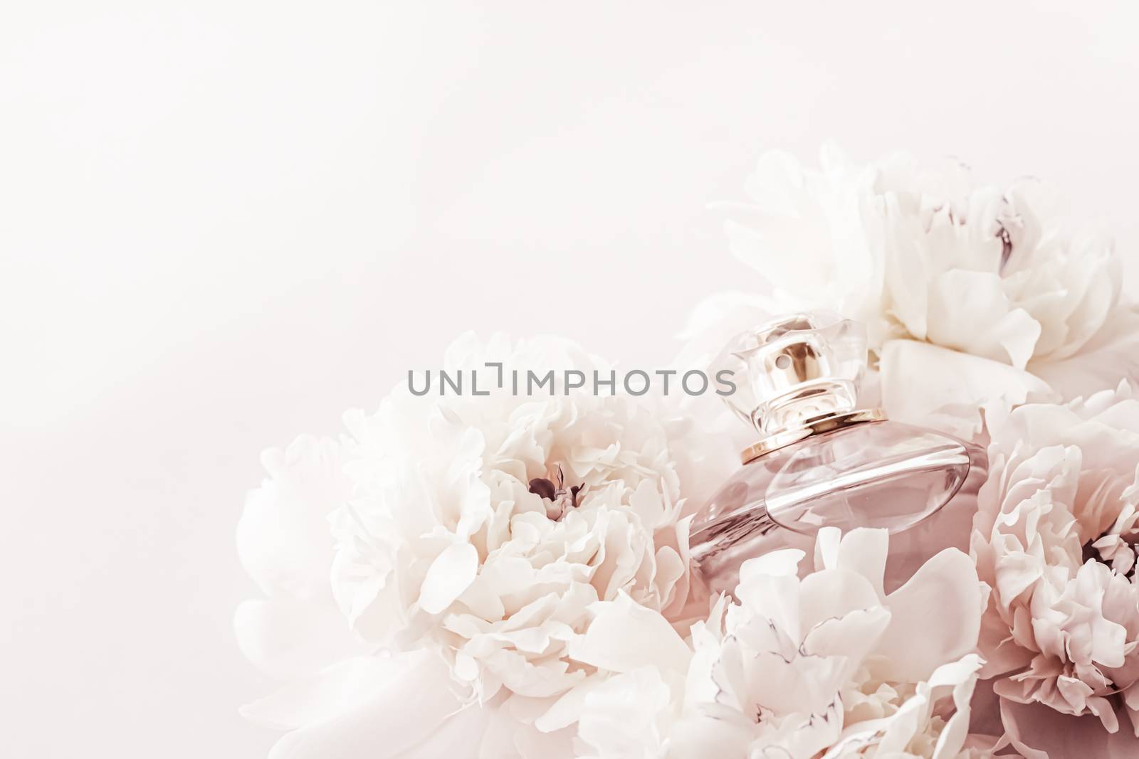 Fragrance bottle as luxury perfume product on background of peony flowers, parfum ad and beauty branding by Anneleven