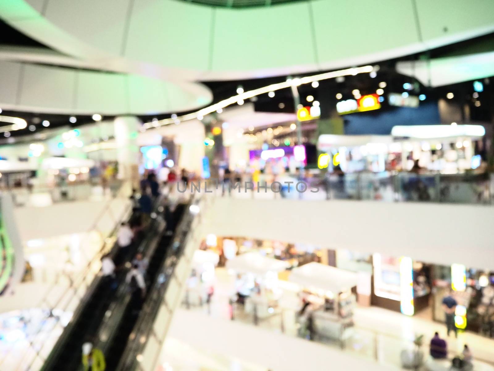 Blurred interior of shopping mall. The modern building concept.