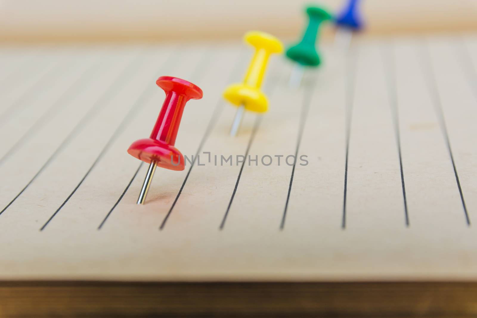 Blank squared note pages with pin. Note paper stuck with pin.