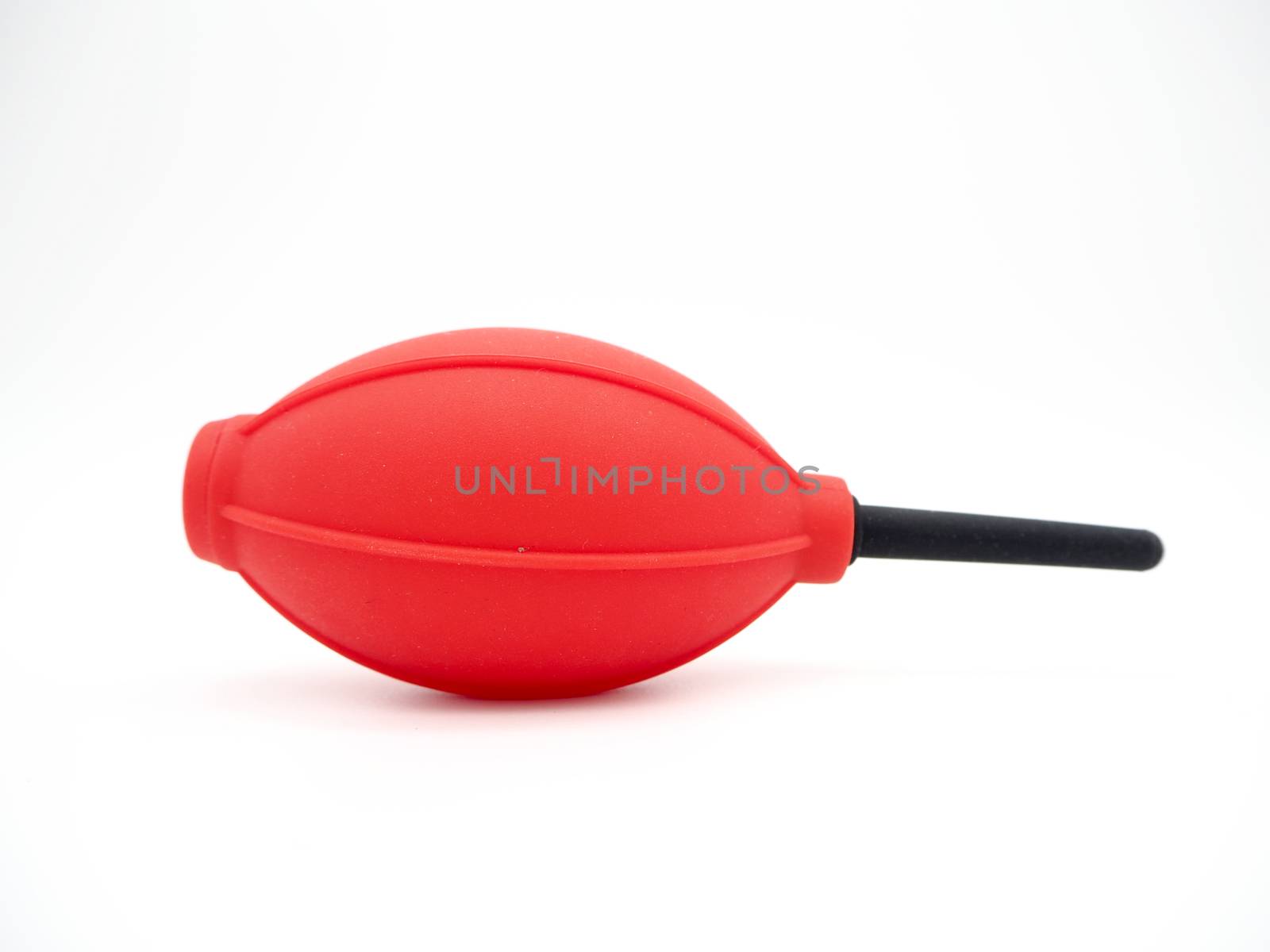 Red camera air blower isolated on a white background.