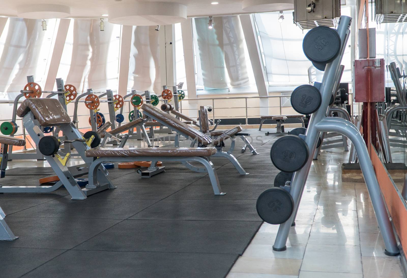 sports equipment and barbells in the gym, interior sports hall