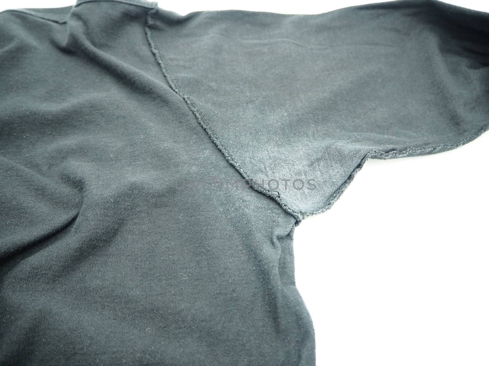 White stain under armpit on T-shirt isolated on white background. 