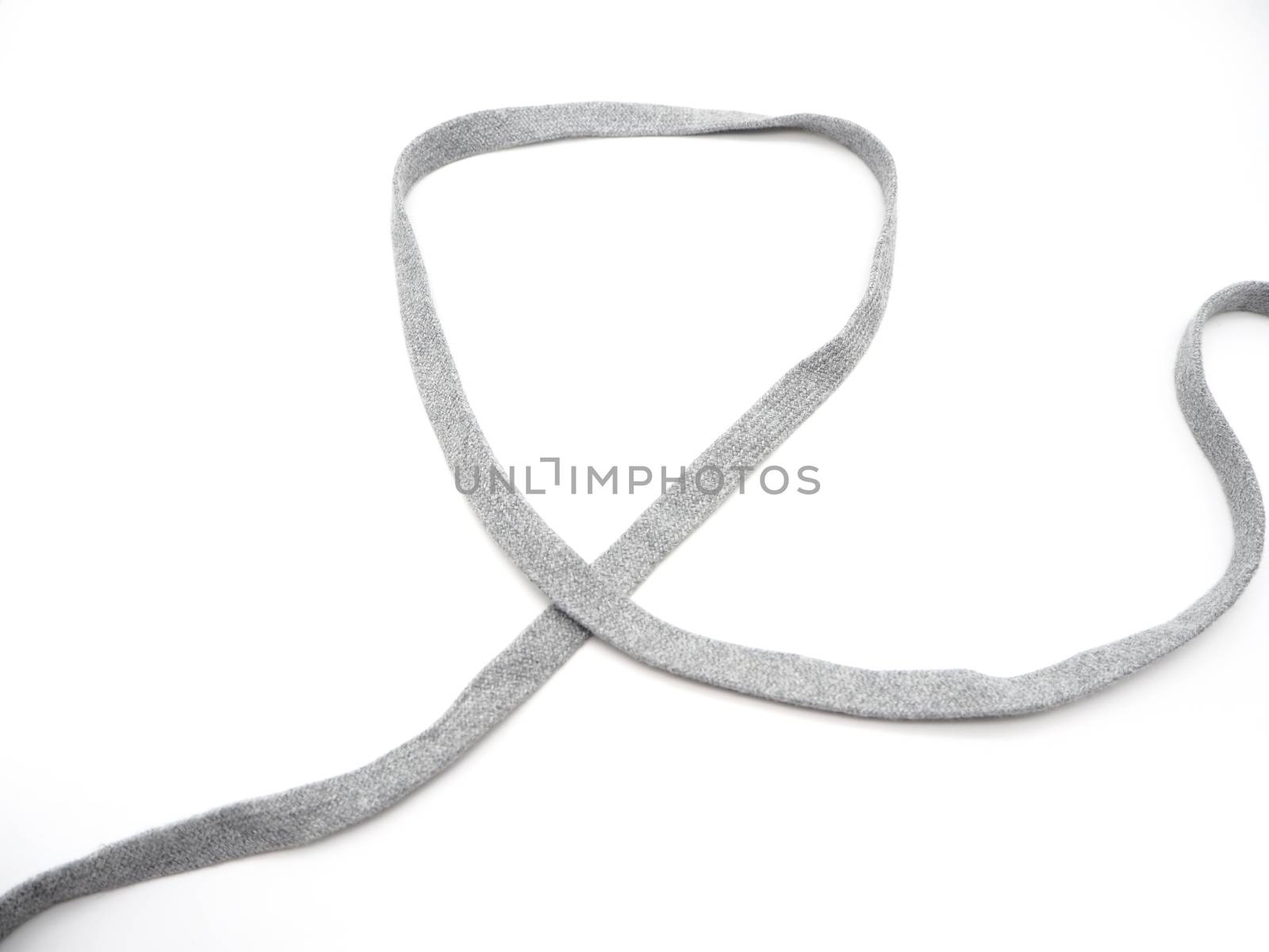 A grey fabric rope isolated on a white background.