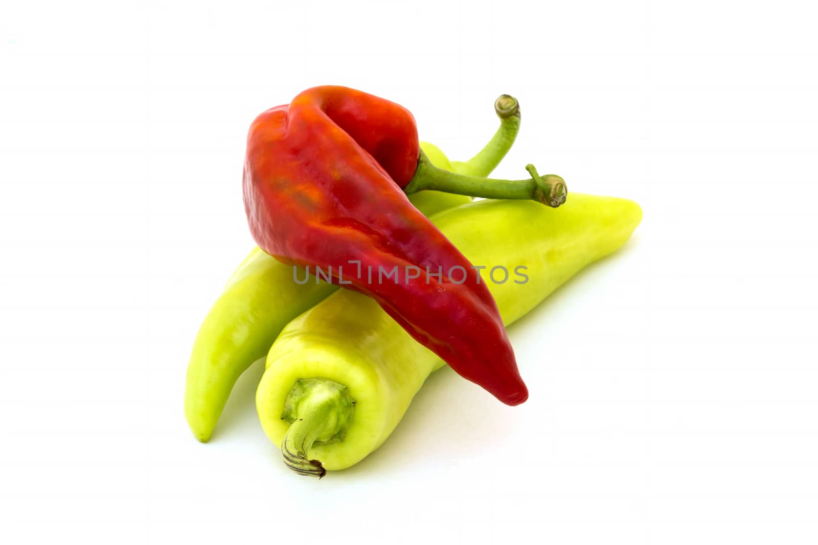 Three fresh peppers isolated background 