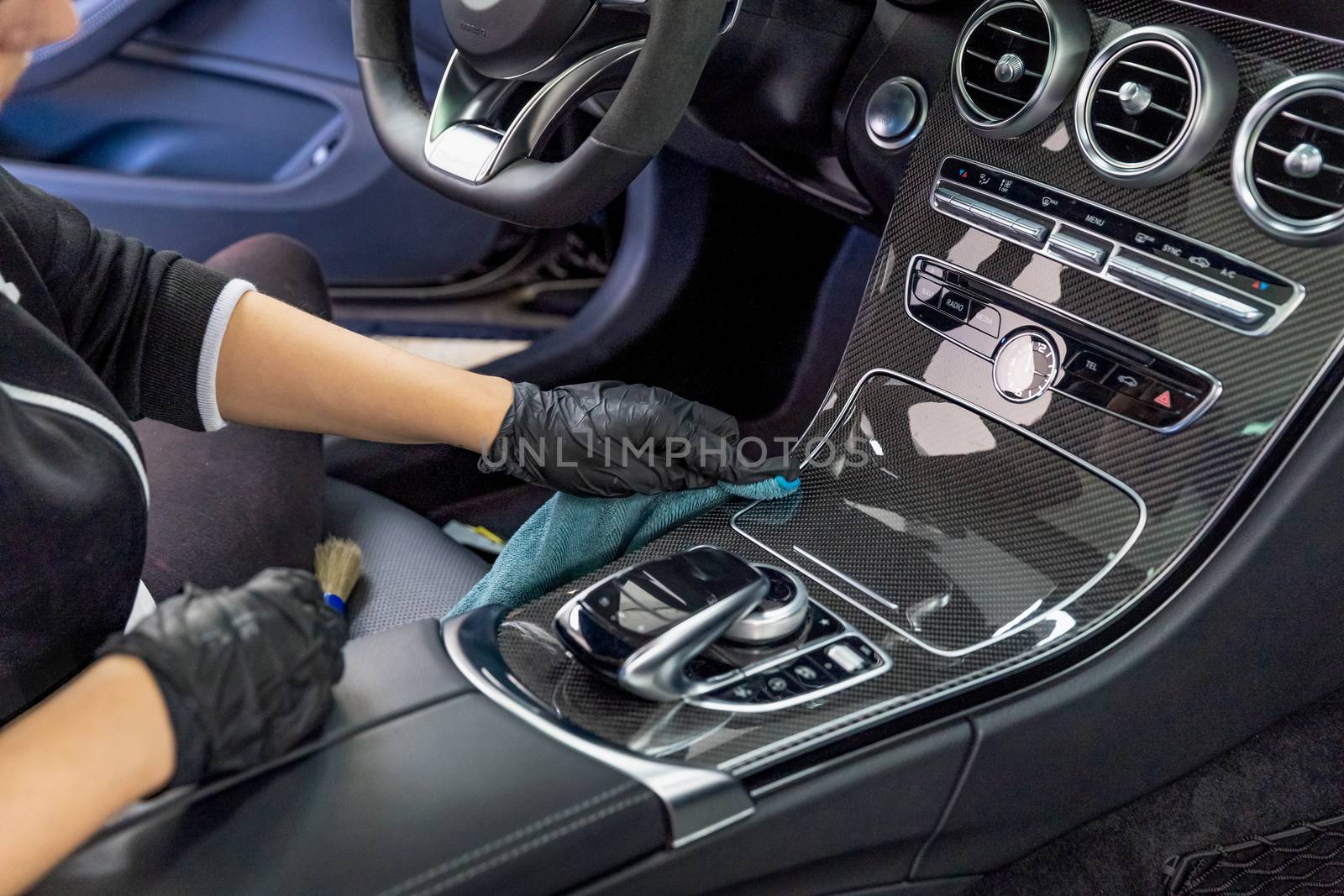 cleaning the interior of a luxury car with the help of chemistry with nanotechnology.