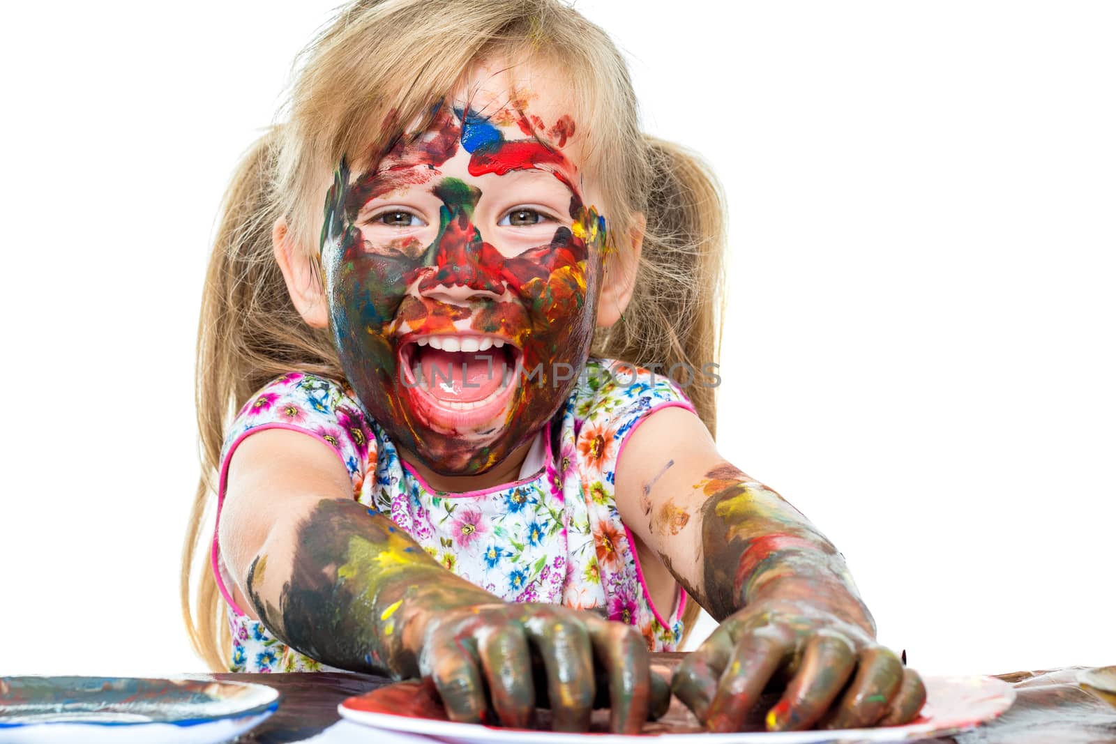 Excited girl having fun with color paint. by karelnoppe