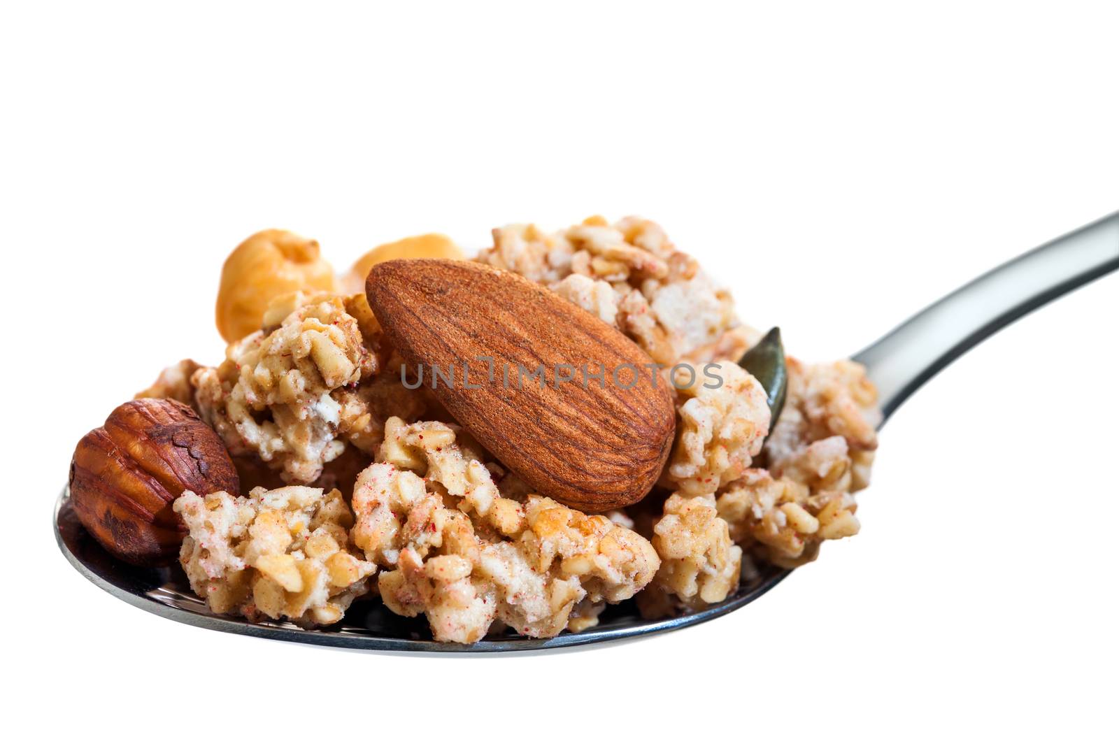 Spoon with crunchy muesli and nuts. by karelnoppe