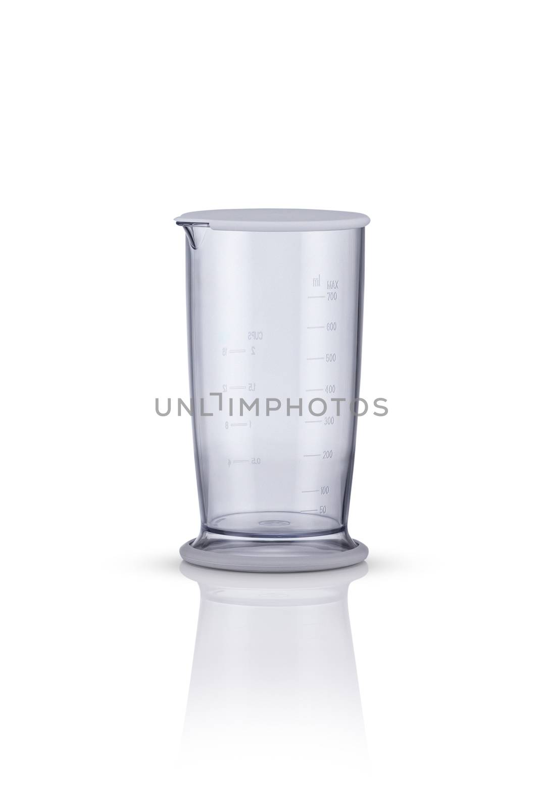 measuring beaker on a white background with reflection. kitchen appliances