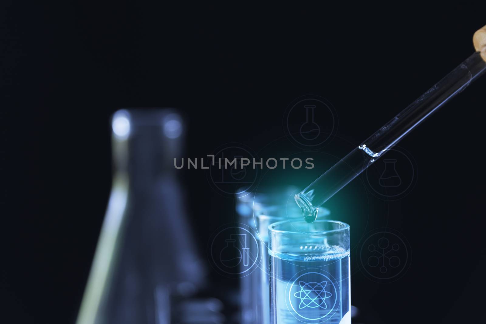 Researcher with glass laboratory chemical test tubes with liquid for analytical , medical, pharmaceutical and scientific research concept.