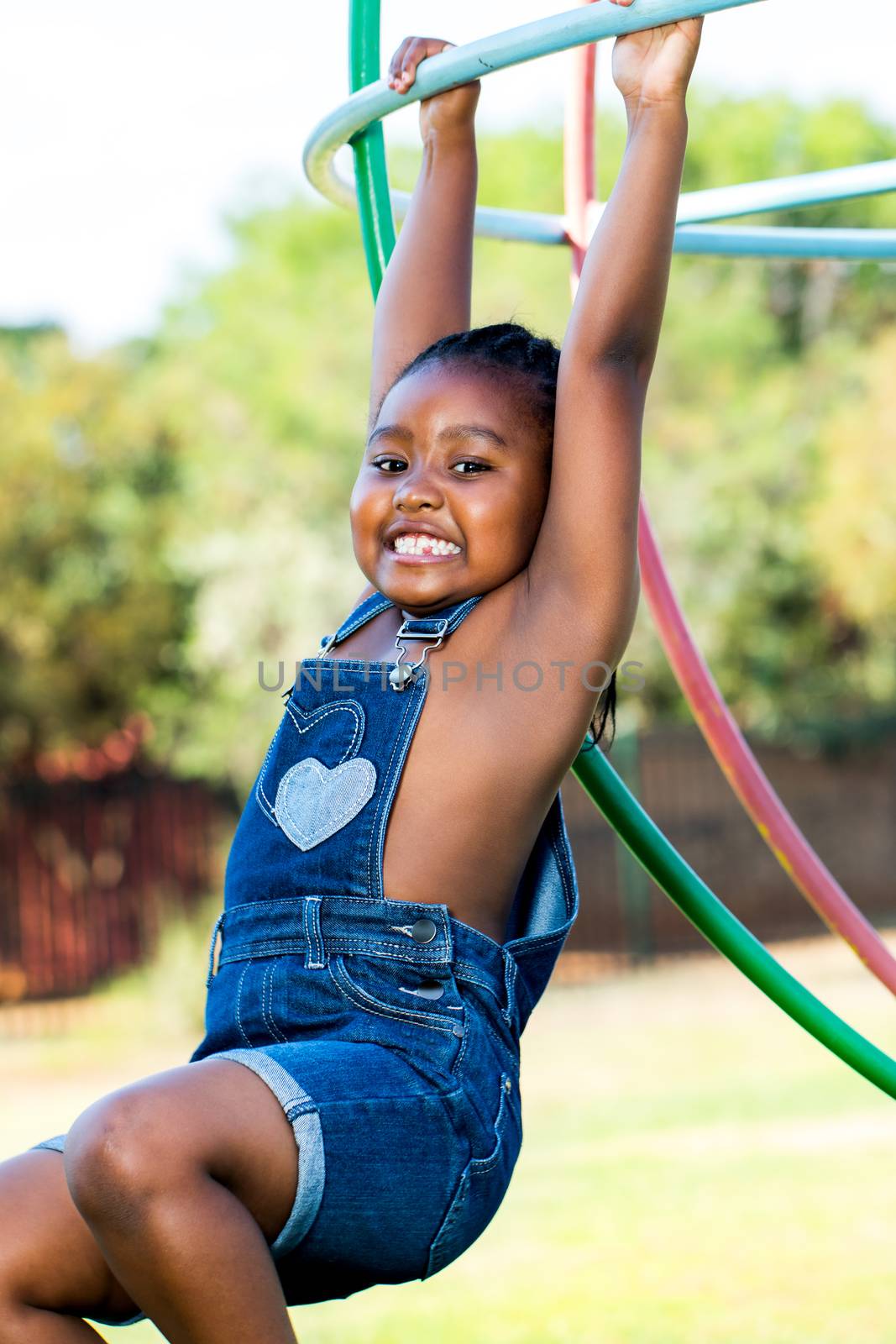 African girl playing in park. by karelnoppe