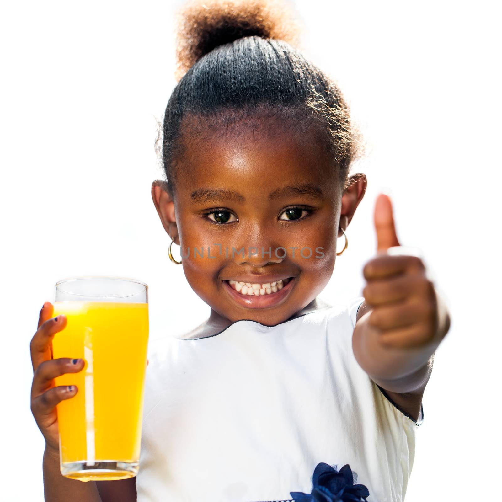 Cute african girl doing thumbs up holding orange juice by karelnoppe