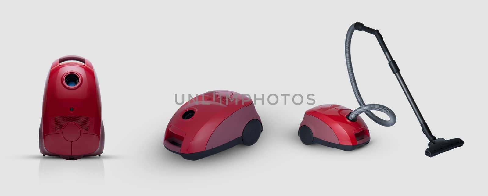 full view of a modern household vacuum cleaner of red color on a white background. for copy space and cut out