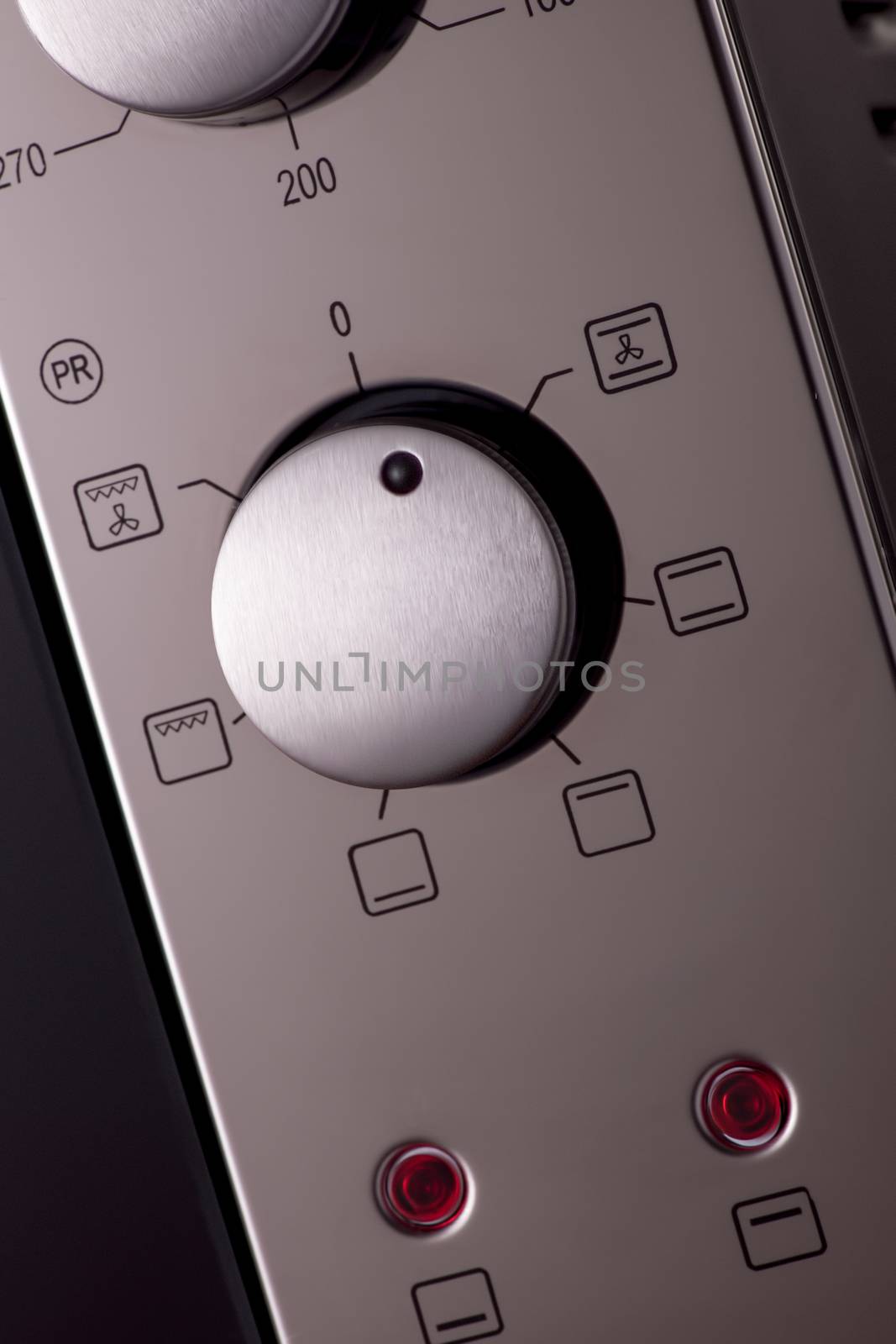 thermostat and handles on a modern microwave, close-up. kitchen equipment