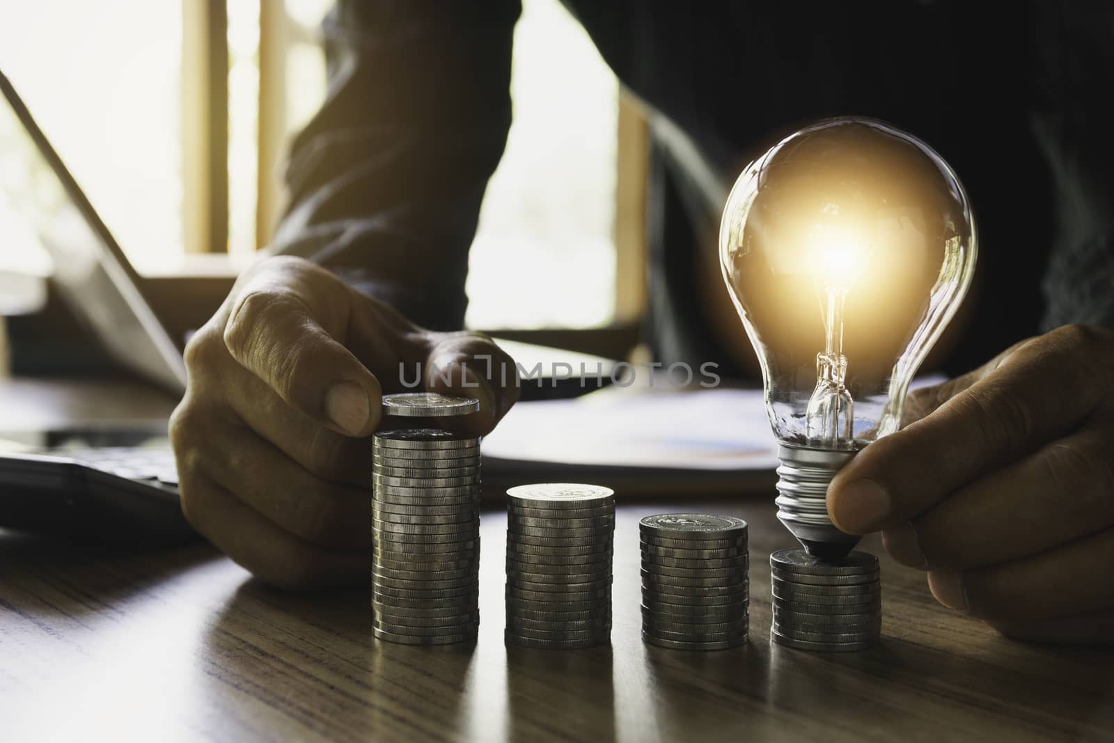 Hand drop a coin with money coin stack growing for business. financial and accounting concept.