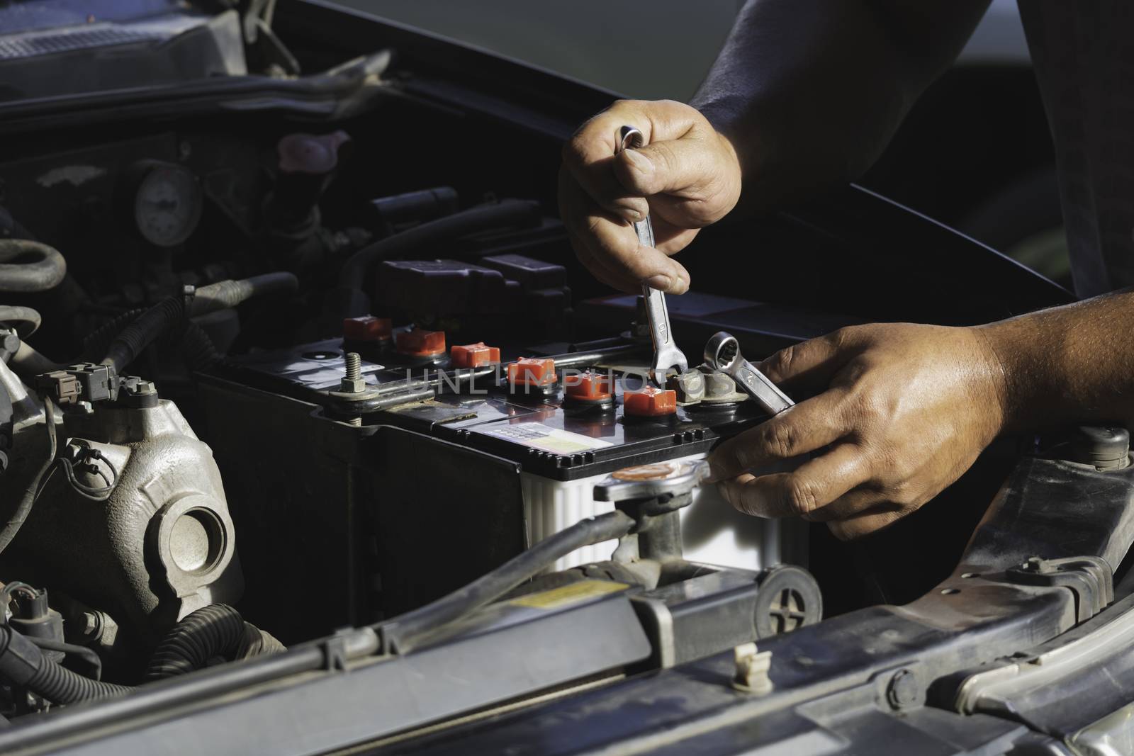 Technician checking engine of car. Auto mechanic checking car engine. Maintenance checking car.