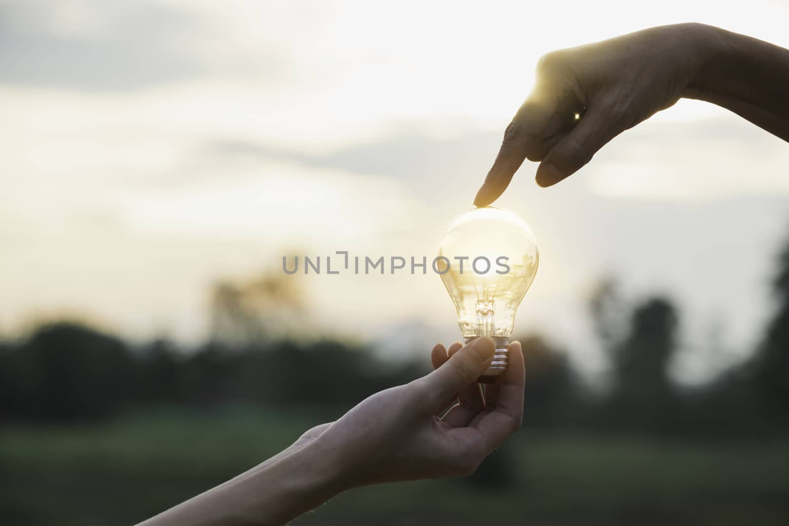 Innovation or creative concept of hand hold a light bulb and copy space for insert text.