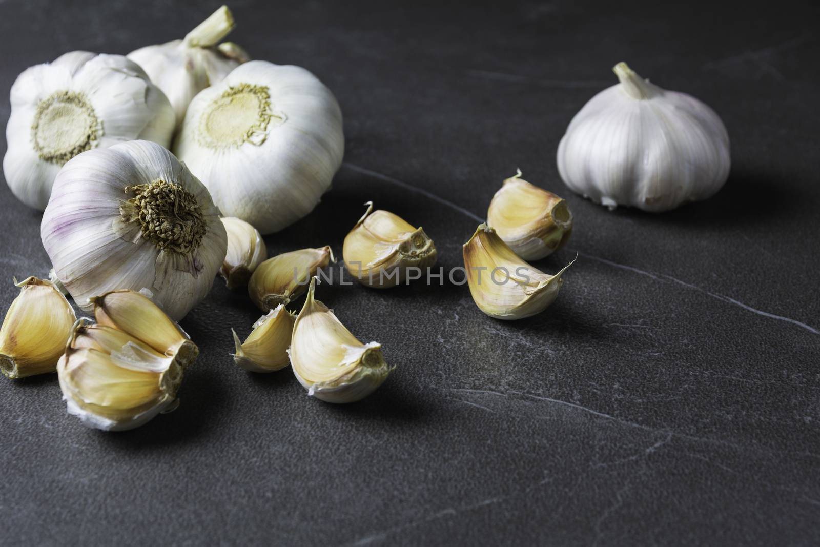 Fresh Garlic sliced and garlic bulb with copy space concept of food and healthy. 