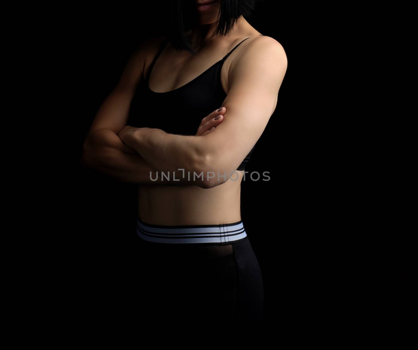 body of a girl of athletic appearance in a black bra by ndanko