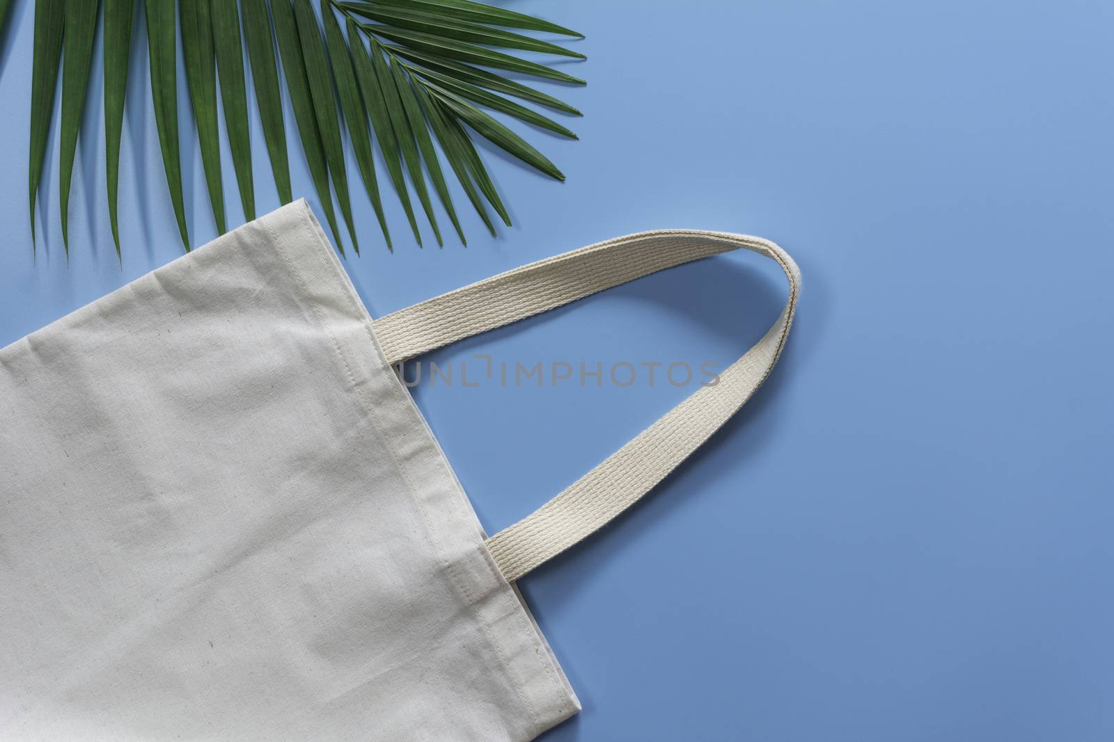 White tote bag canvas fabric. Cloth shopping sack mockup with copy space.