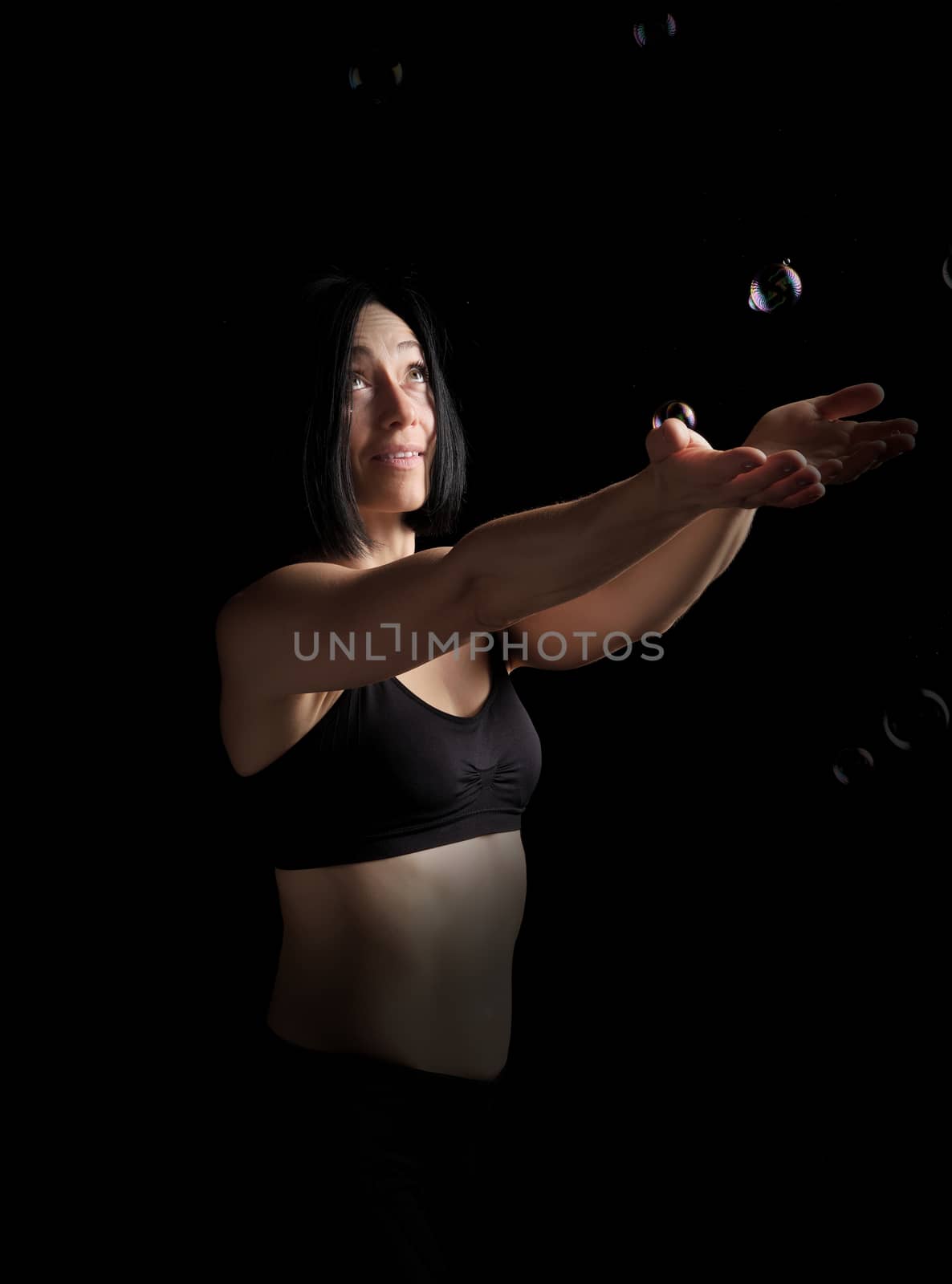 beautiful athletic woman with muscular body dressed with a black by ndanko