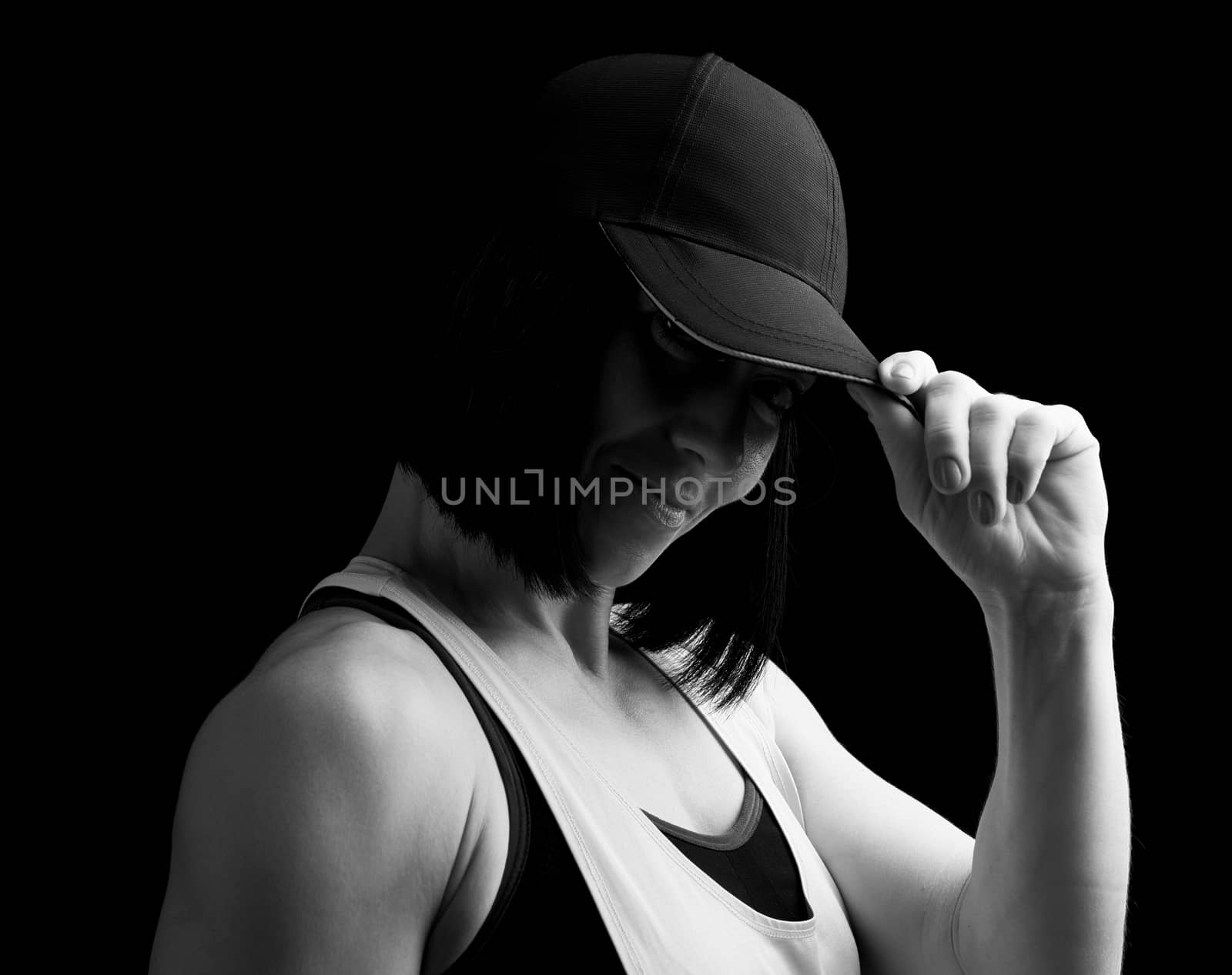 portrait of an adult girl with black hair holding a cap by ndanko